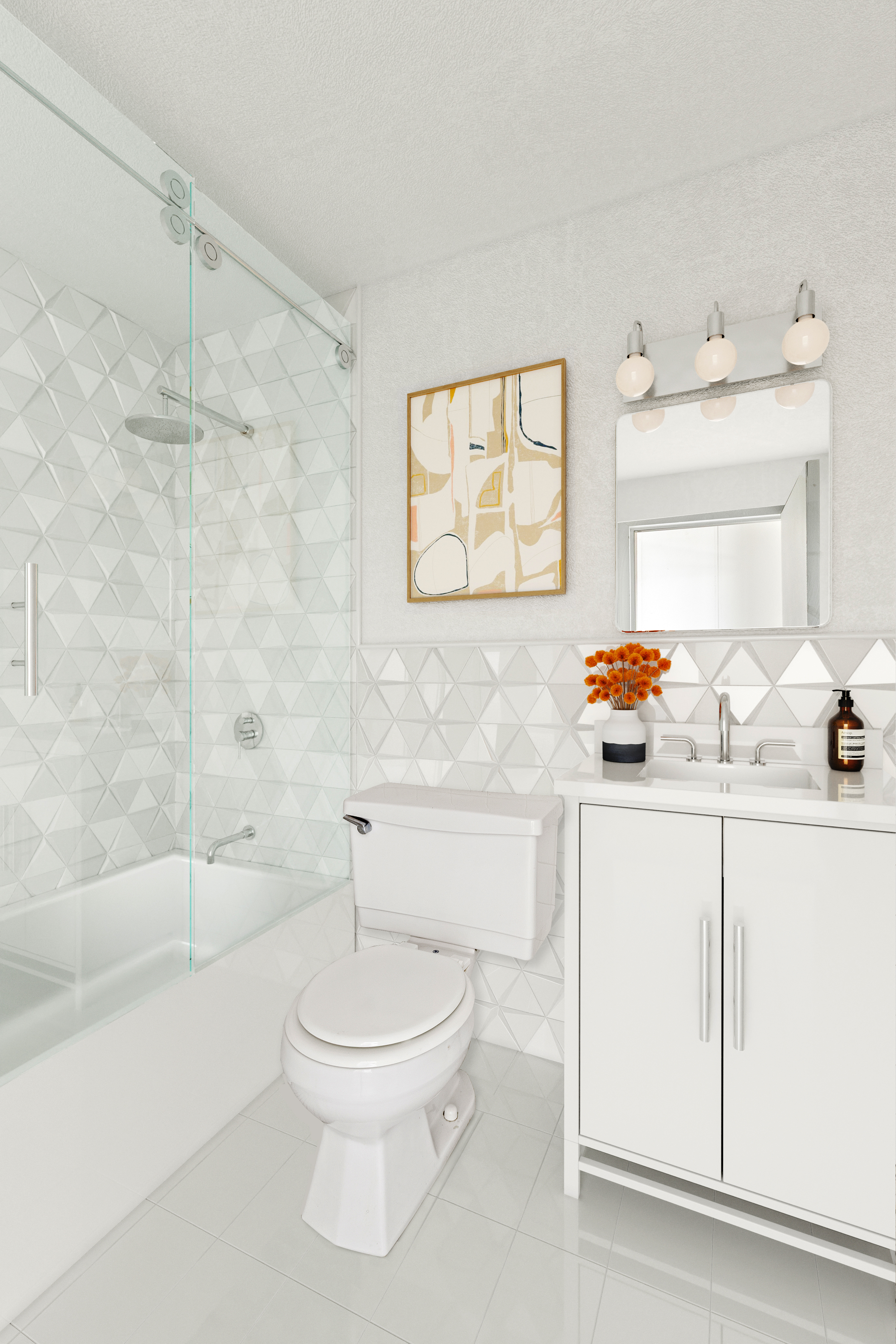 180 Park Row, Unit 25E Manhattan, NY 10007 - Photo 8 of 11 a bathroom with a sink a toilet and a bathtub