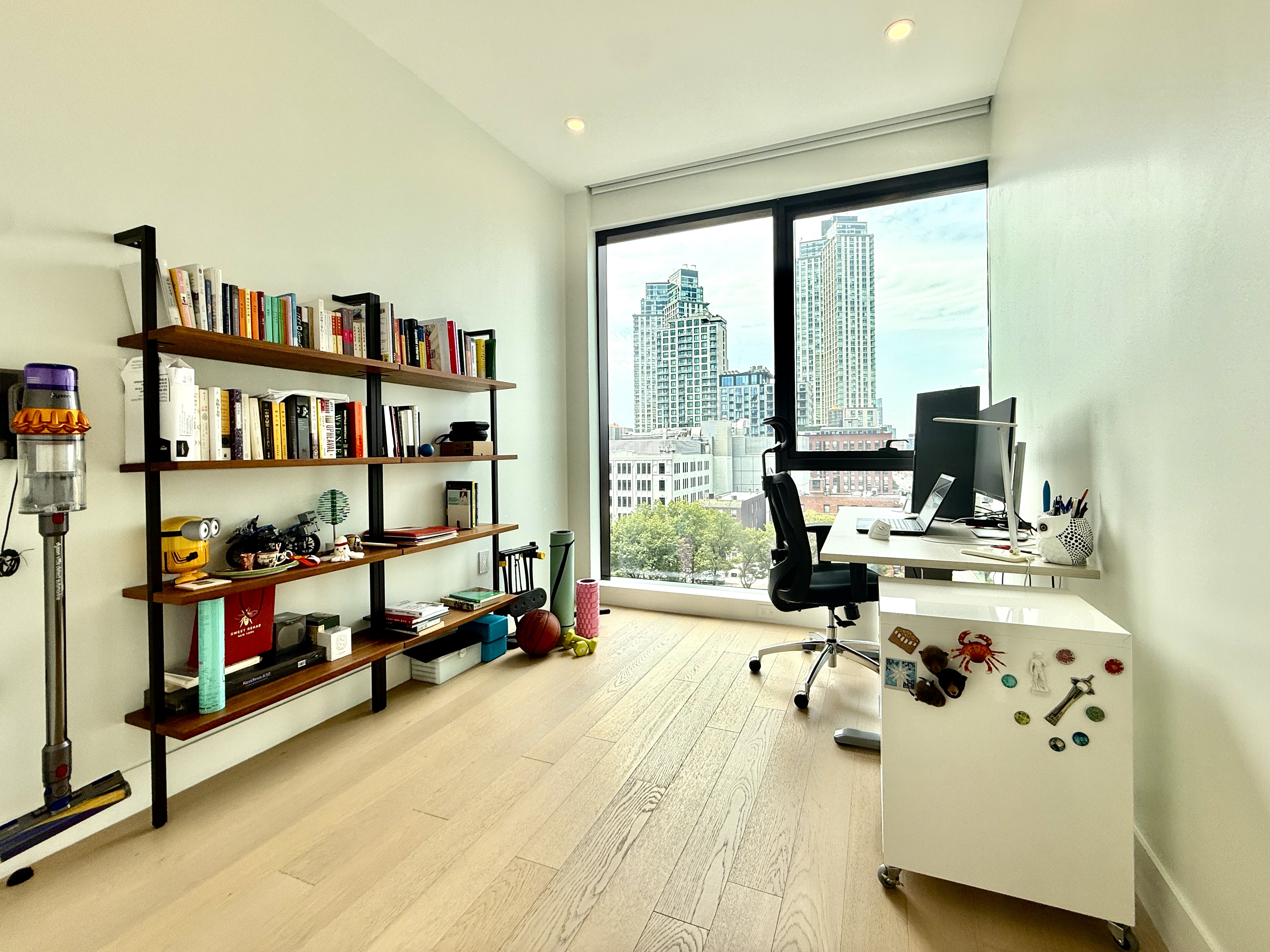 4507 Court Square, Unit 8D Queens, NY 11101 - Photo 11 of 28 a view of a living room with furniture and floor to ceiling window
