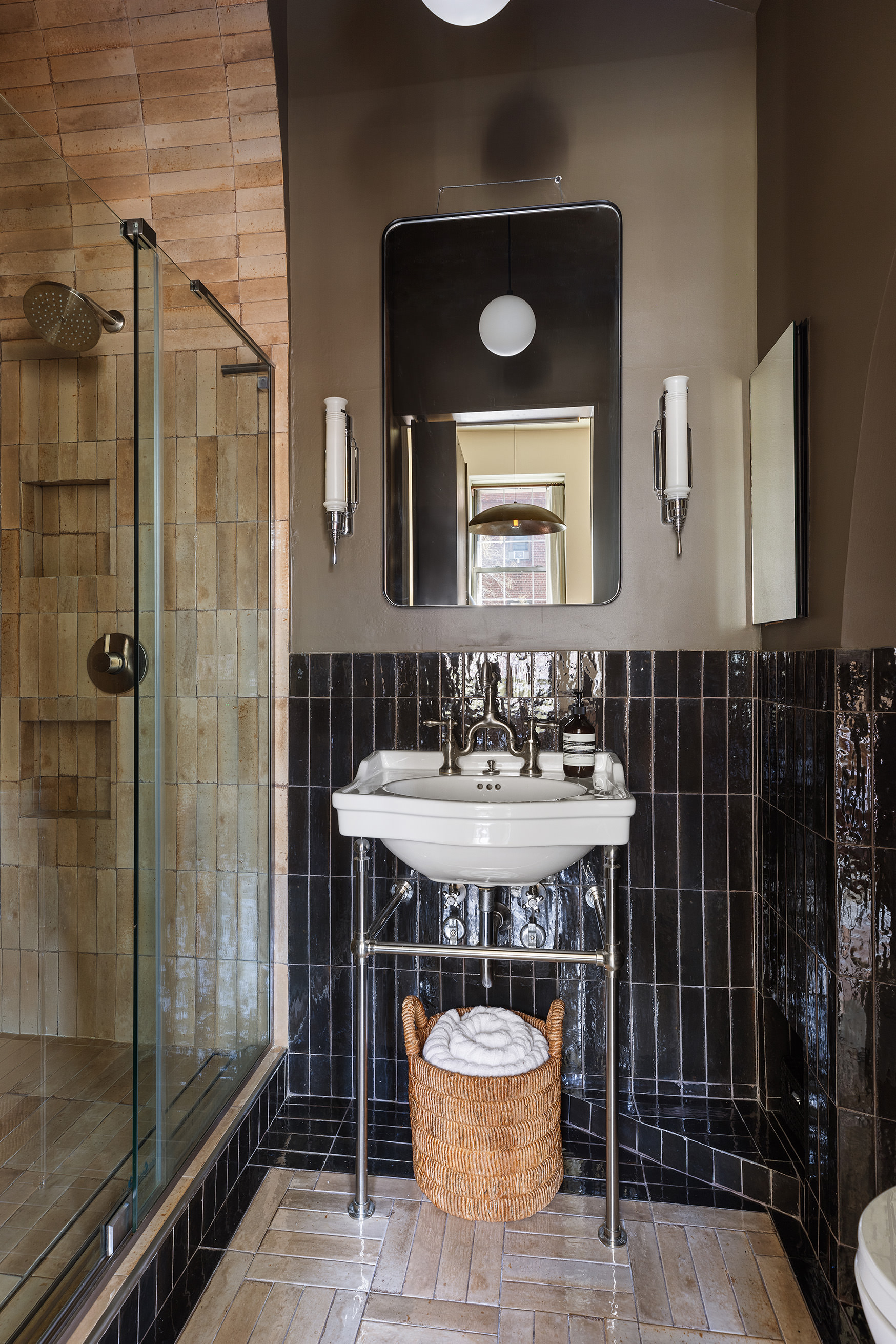 207 West 21st Street, Unit 3F Manhattan, NY 10011 - Photo 10 of 12 a bathroom with a sink and a mirror