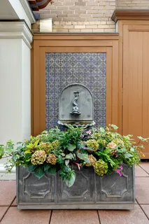 a potted plant sitting on top of a wooden door