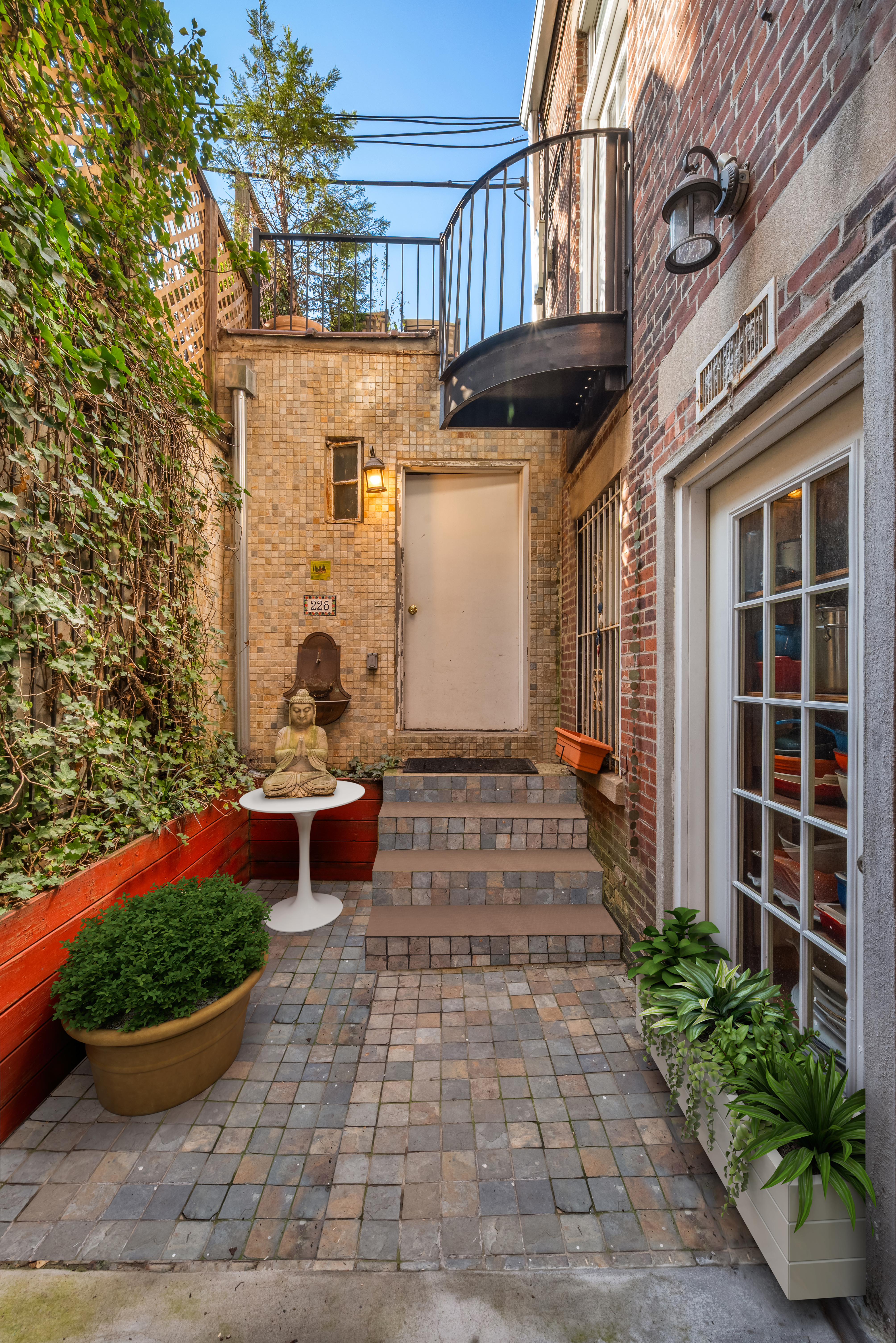 226 West 139th Street Boston, NY 10030 - Photo 5 of 14 a front view of a building with outdoor seating