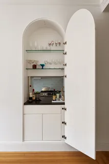 a kitchen with a stove and cabinets