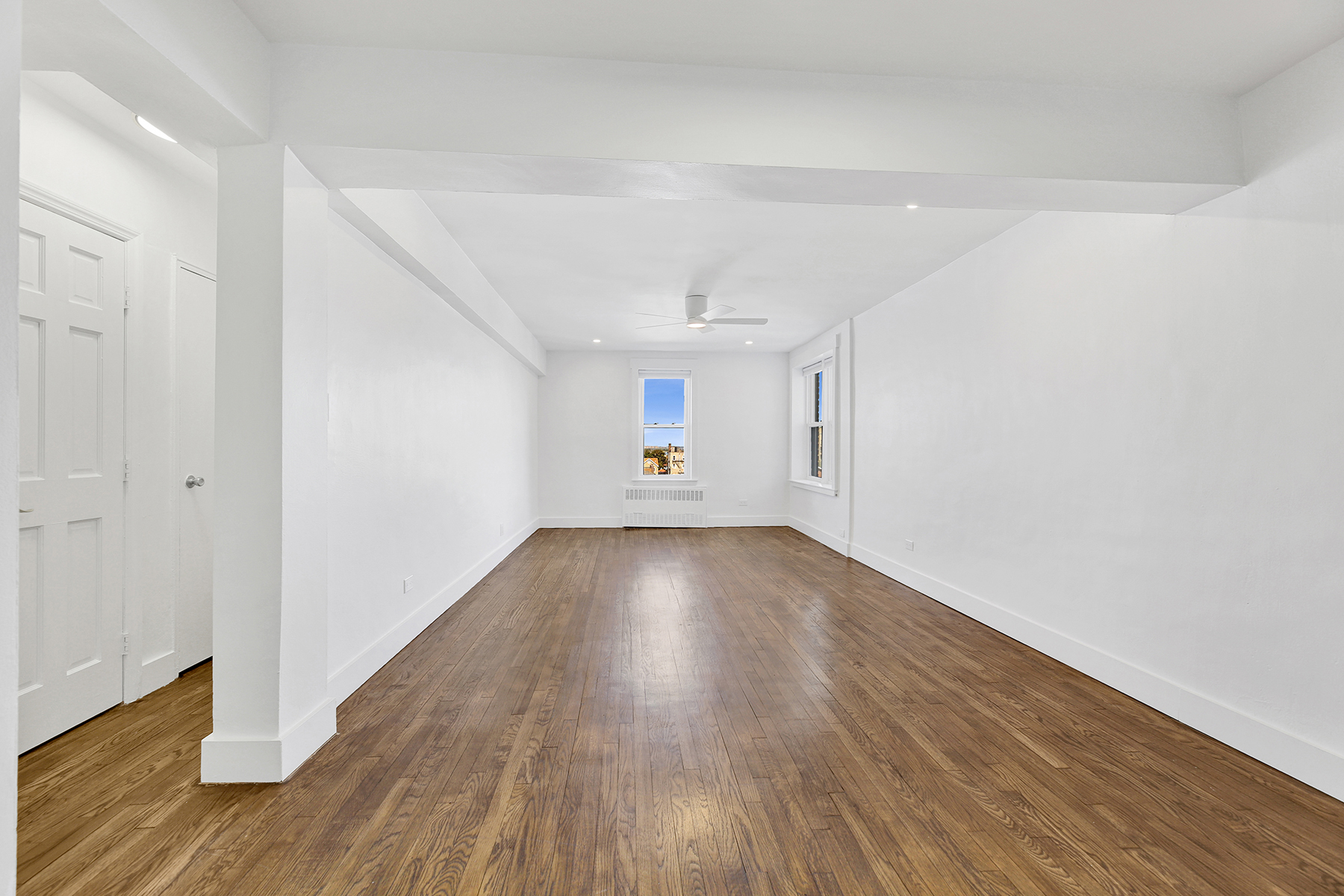 125 Beach 124th Street, Unit 5K Queens, NY 11694 - Photo 6 of 21 a view of empty room with wooden floor