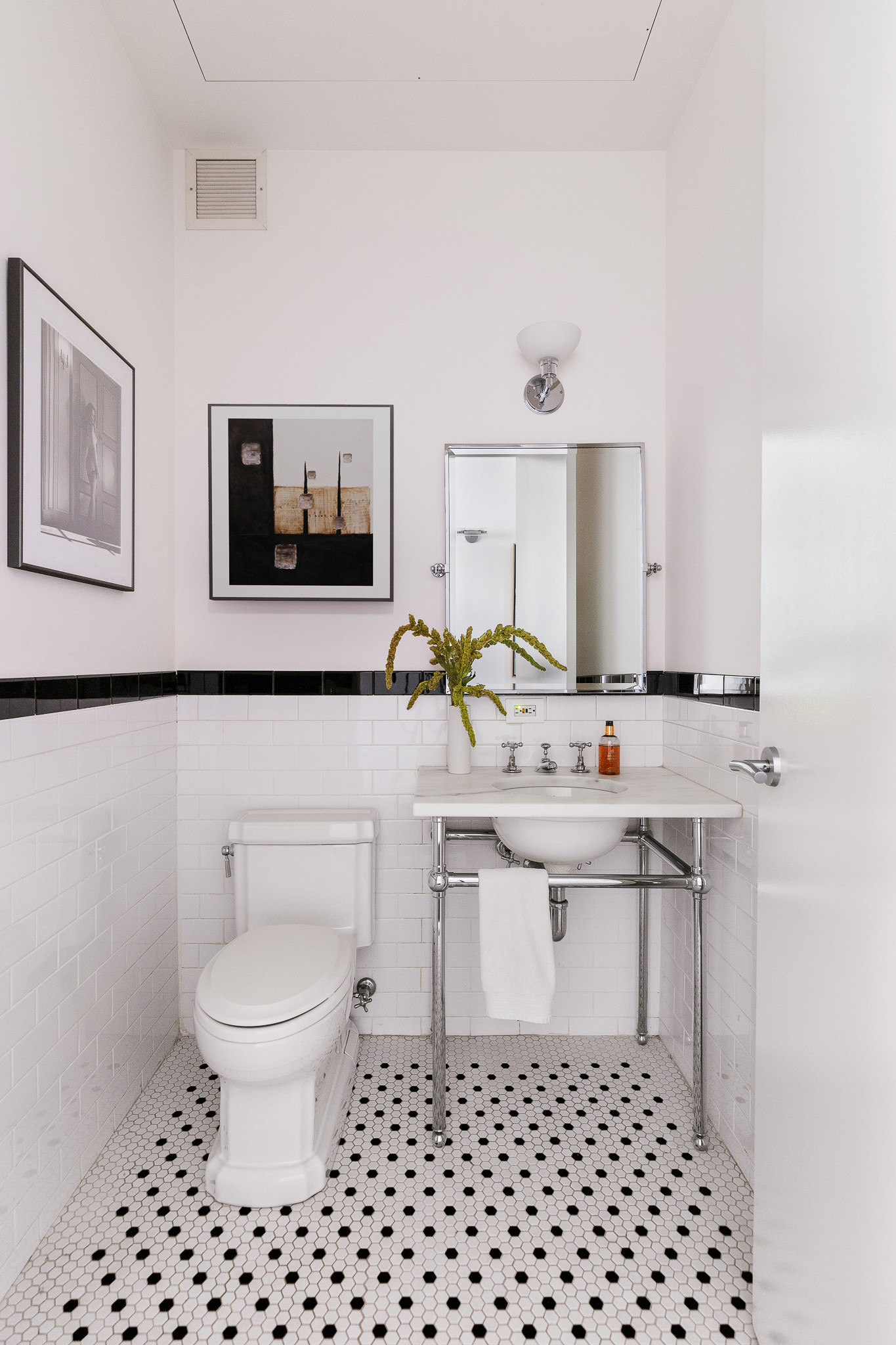 388 West Broadway, Unit 2 Manhattan, NY 10012 - Photo 11 of 27 a bathroom with a sink a toilet and mirror
