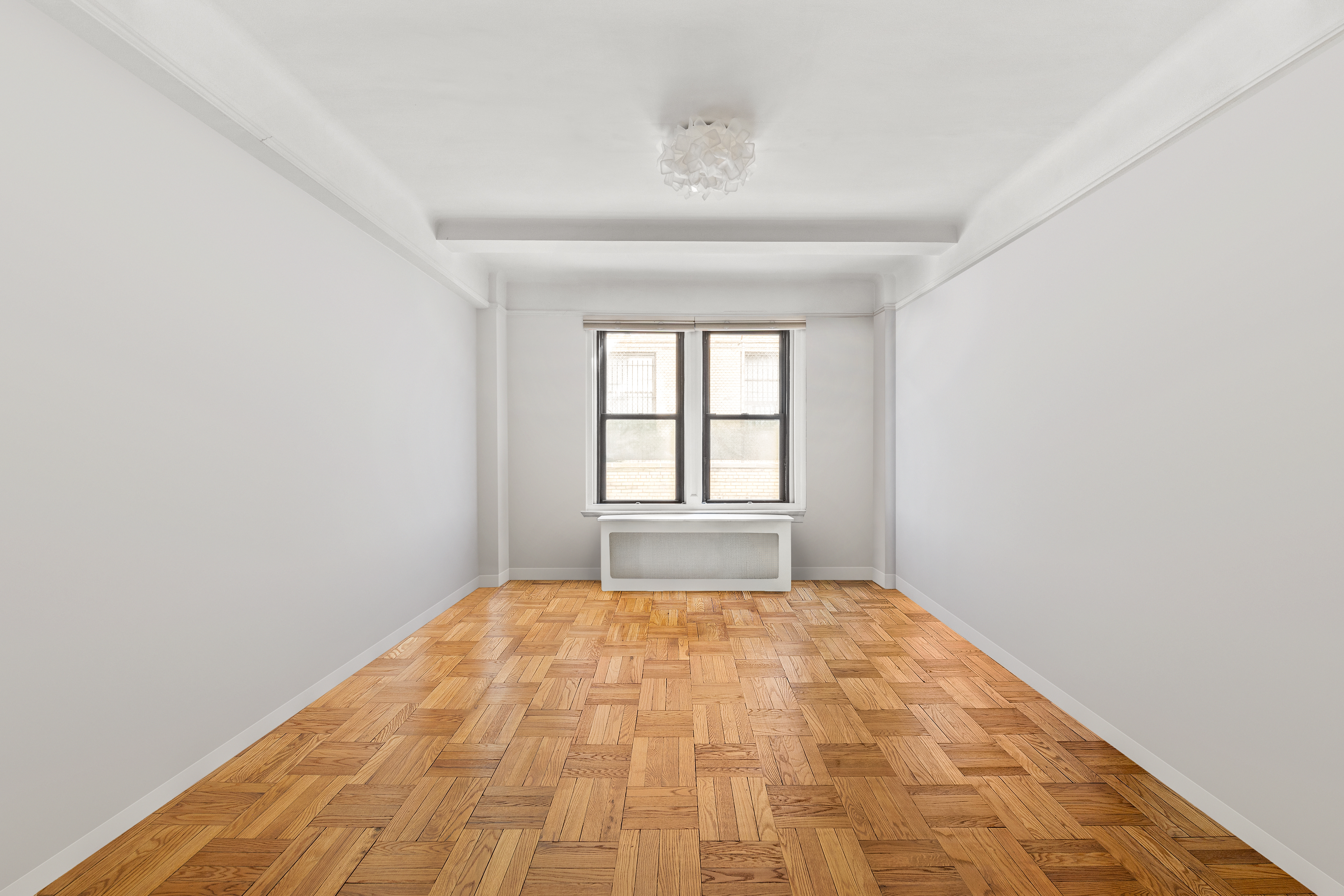 70 East 96th Street, Unit 2D Manhattan, NY 10128 - Photo 12 of 14 a view of empty room with window