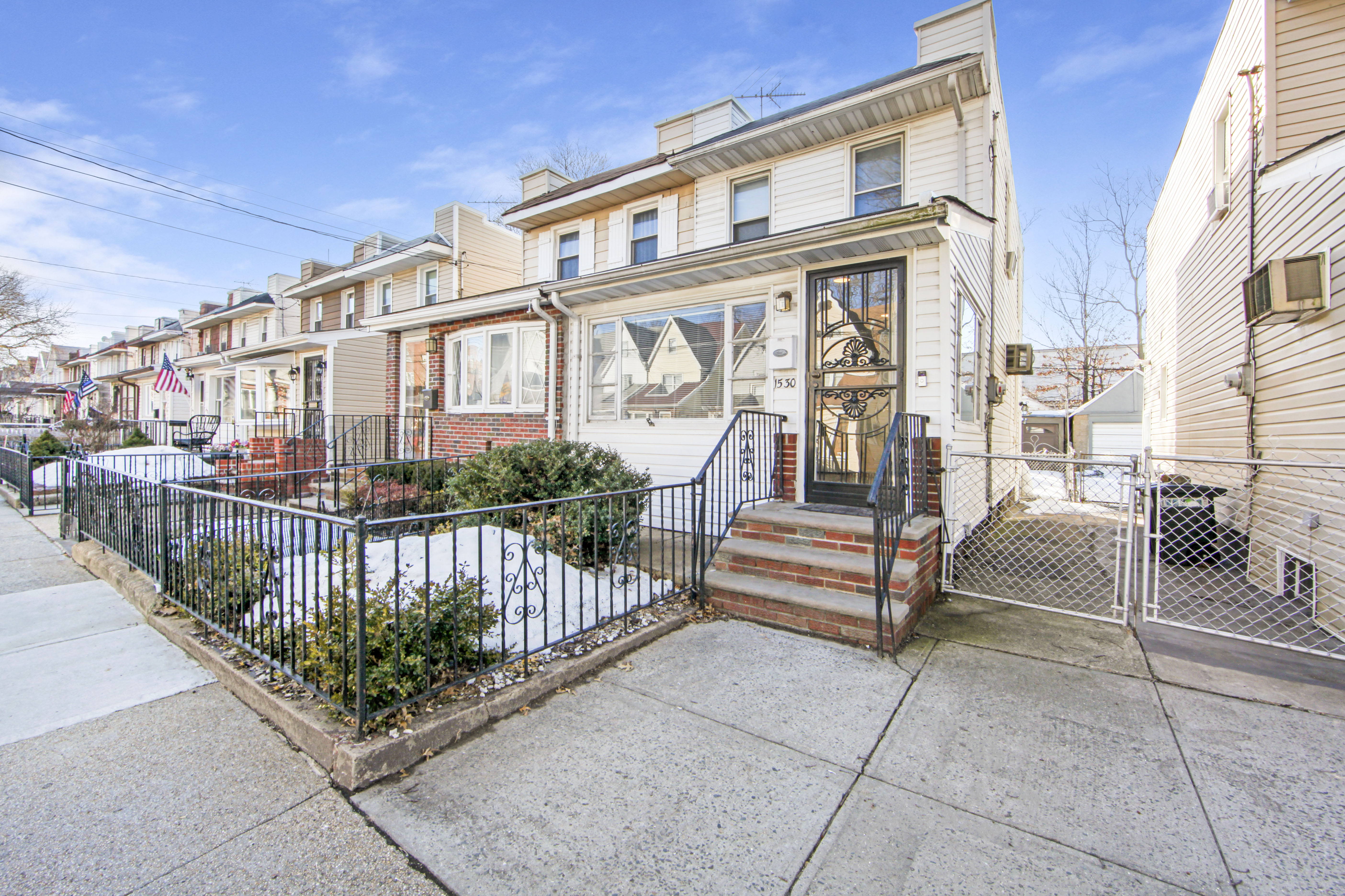 1530 East 51st Street Brooklyn, NY 11234 - Photo 12 of 14 a front view of a house with a garden