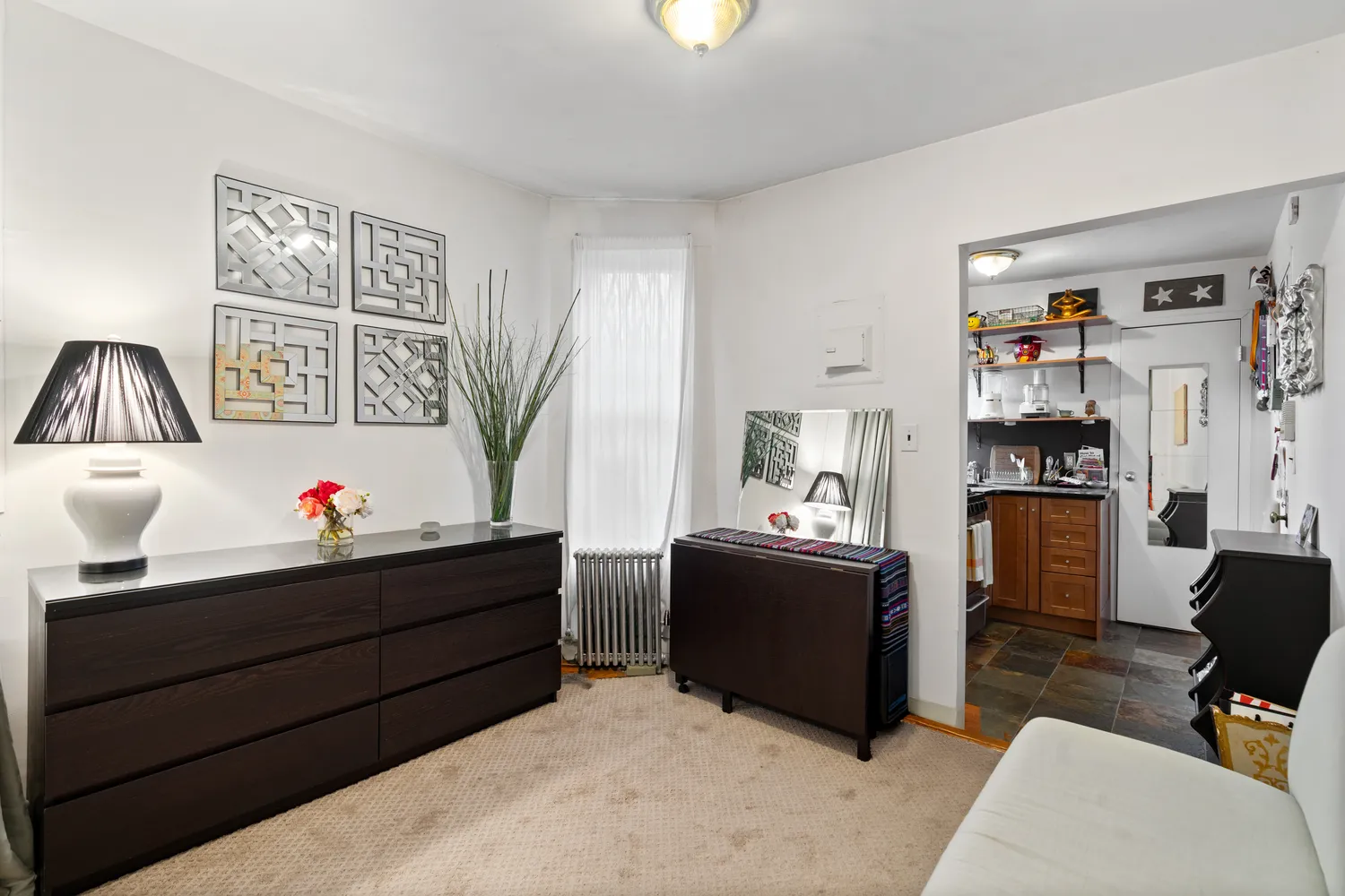 a living room with furniture and a window