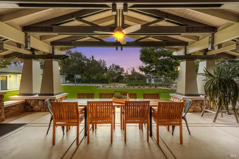a view of a patio with swimming pool table and chairs
