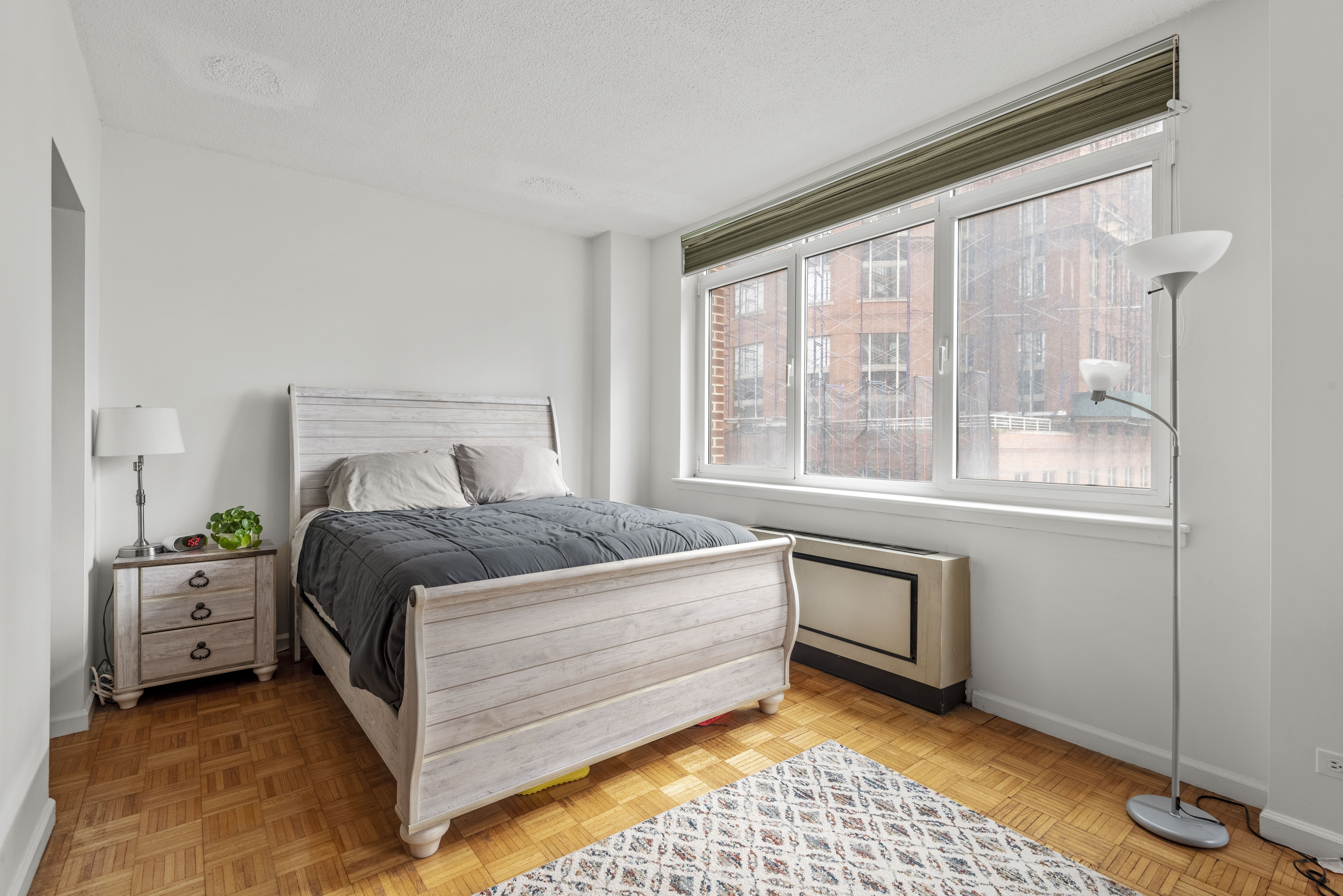 45 West 67th Street, Unit 14D Manhattan, NY 10023 - Photo 6 of 13 a bedroom with a bed and window