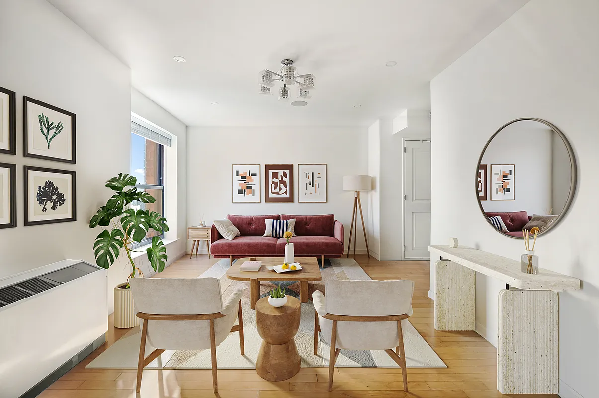 a living room with furniture a potted plant and a chandelier
