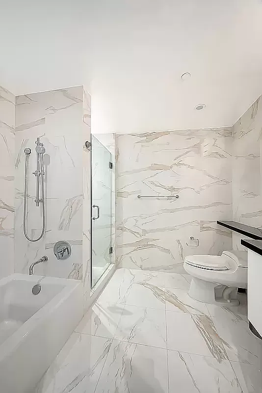 84 White Street, Unit 3A Manhattan, NY 10013 - Photo 5 of 6 a bathroom with a toilet sink and shower