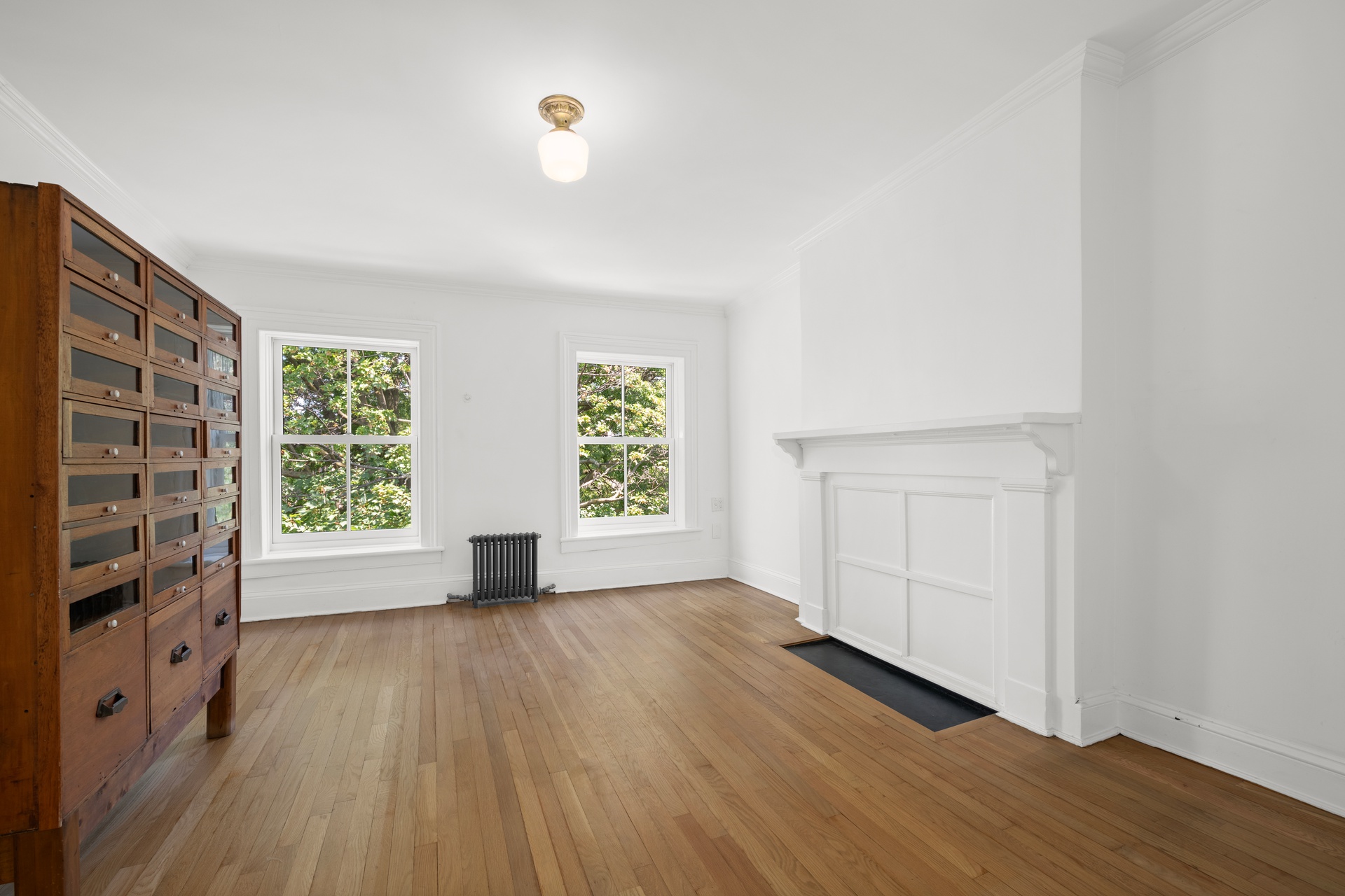 73 St James Place, Unit 2 Brooklyn, NY 11238 - Photo 10 of 15 an empty room with wooden floor and windows