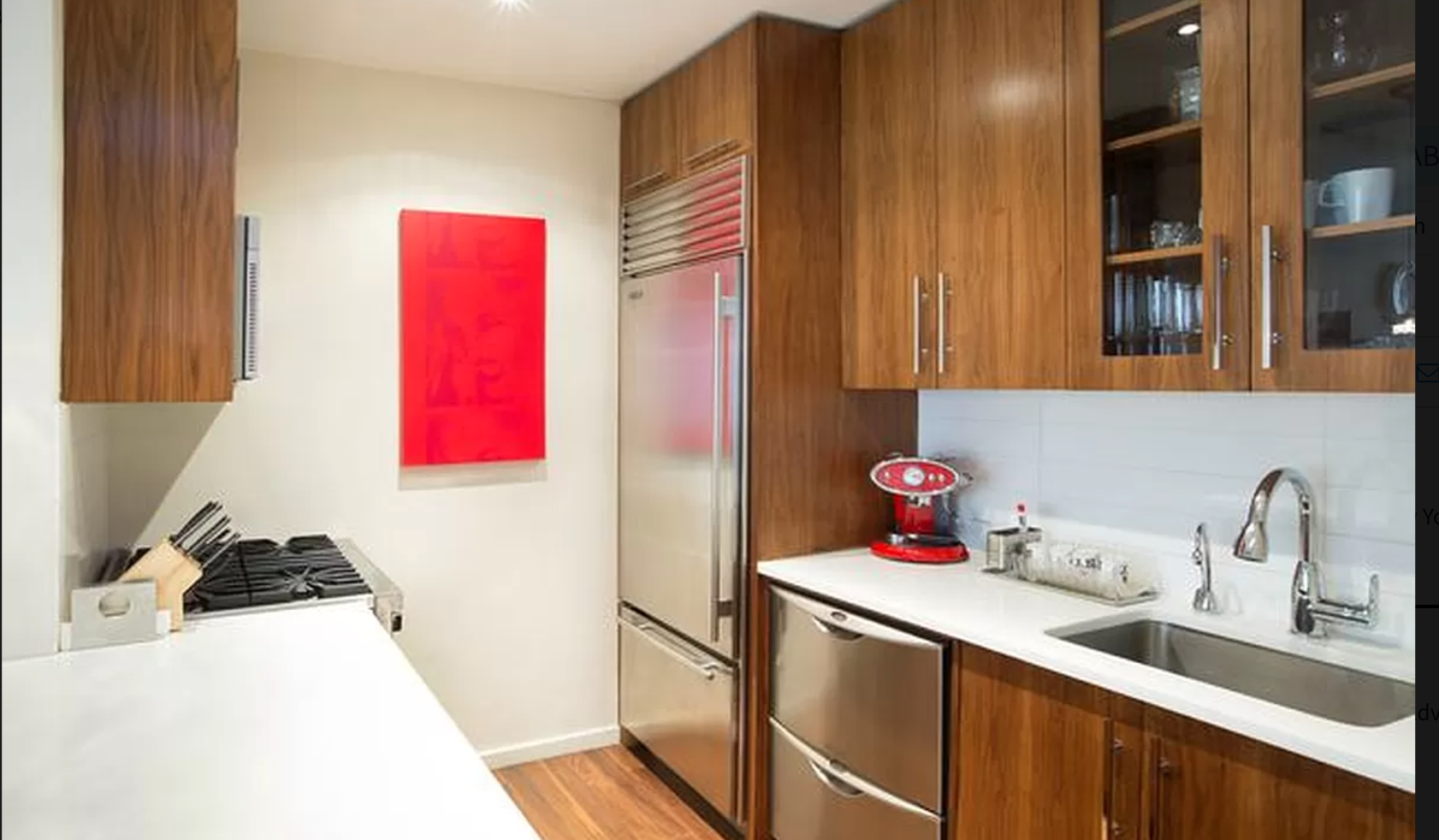 88 Greenwich Street, Unit 911 Manhattan, NY 10006 - Photo 3 of 10 a kitchen with a sink stove and cabinets