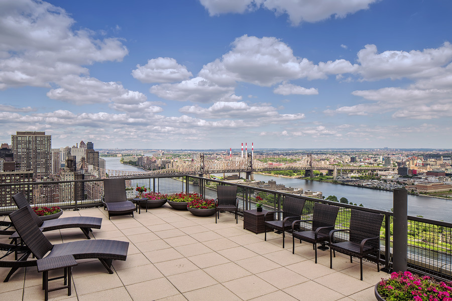 870 United Nations Plaza, Unit 14F Manhattan, NY 10017 - Photo 13 of 16 a view of a terrace with furniture