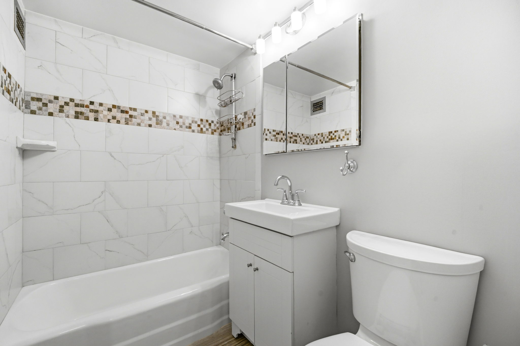 139 East 33rd Street, Unit 12DE Manhattan, NY 10016 - Photo 22 of 27 a bathroom with a sink a toilet and shower