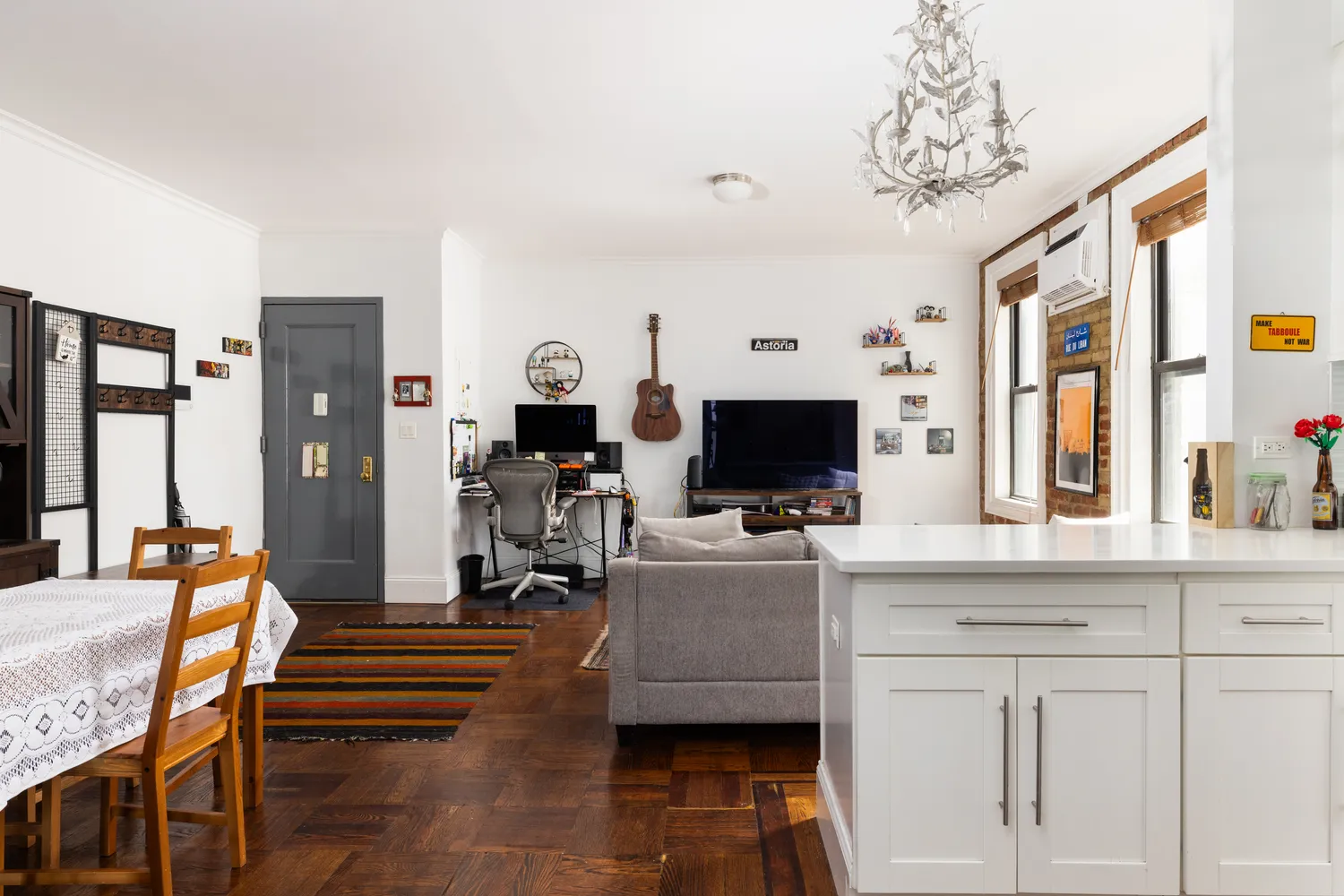 a living room with furniture and a flat screen tv
