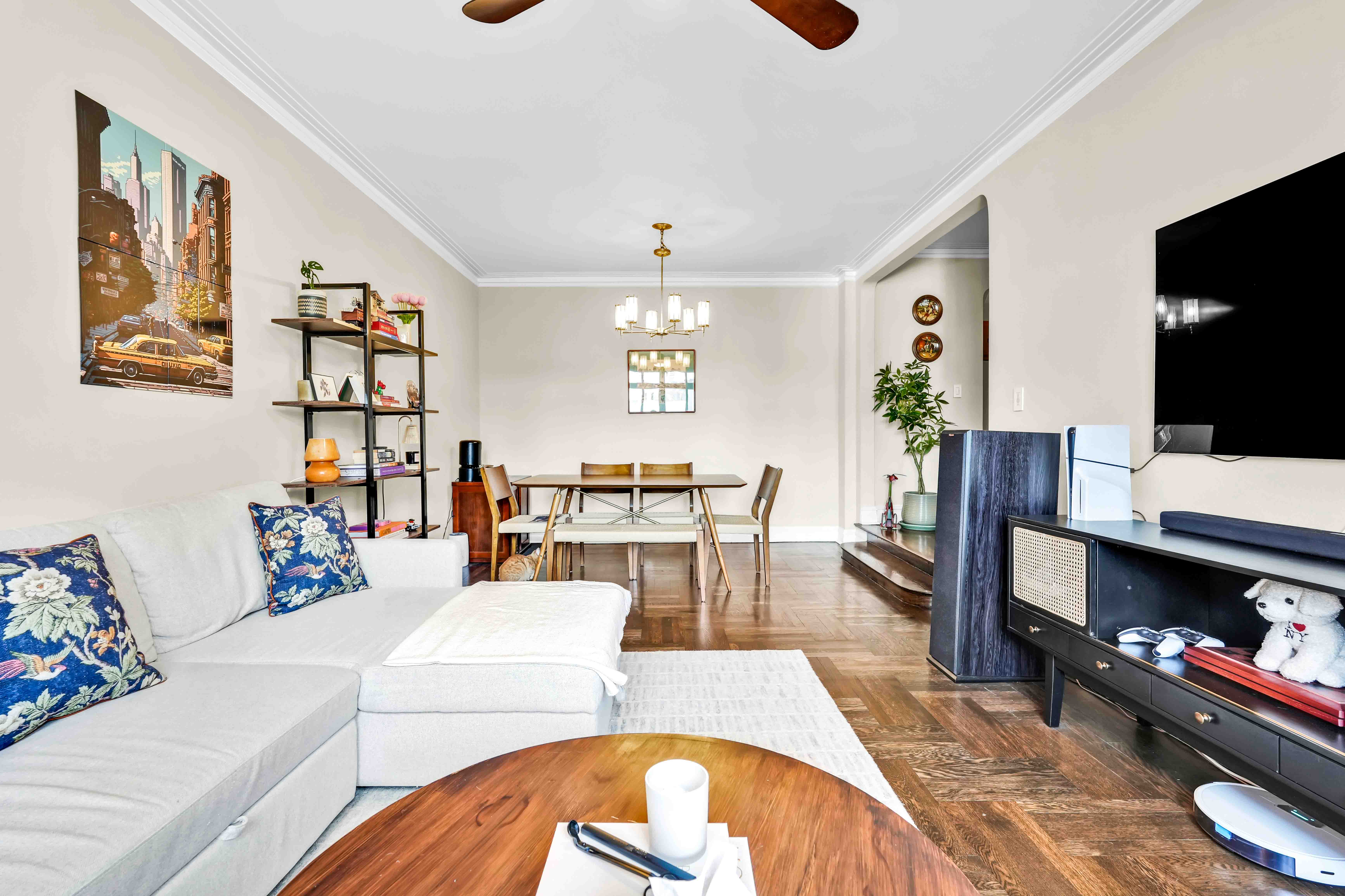 255 West 23rd Street, Unit 5GW Manhattan, NY 10011 - Photo 5 of 35 a living room with furniture and a flat screen tv