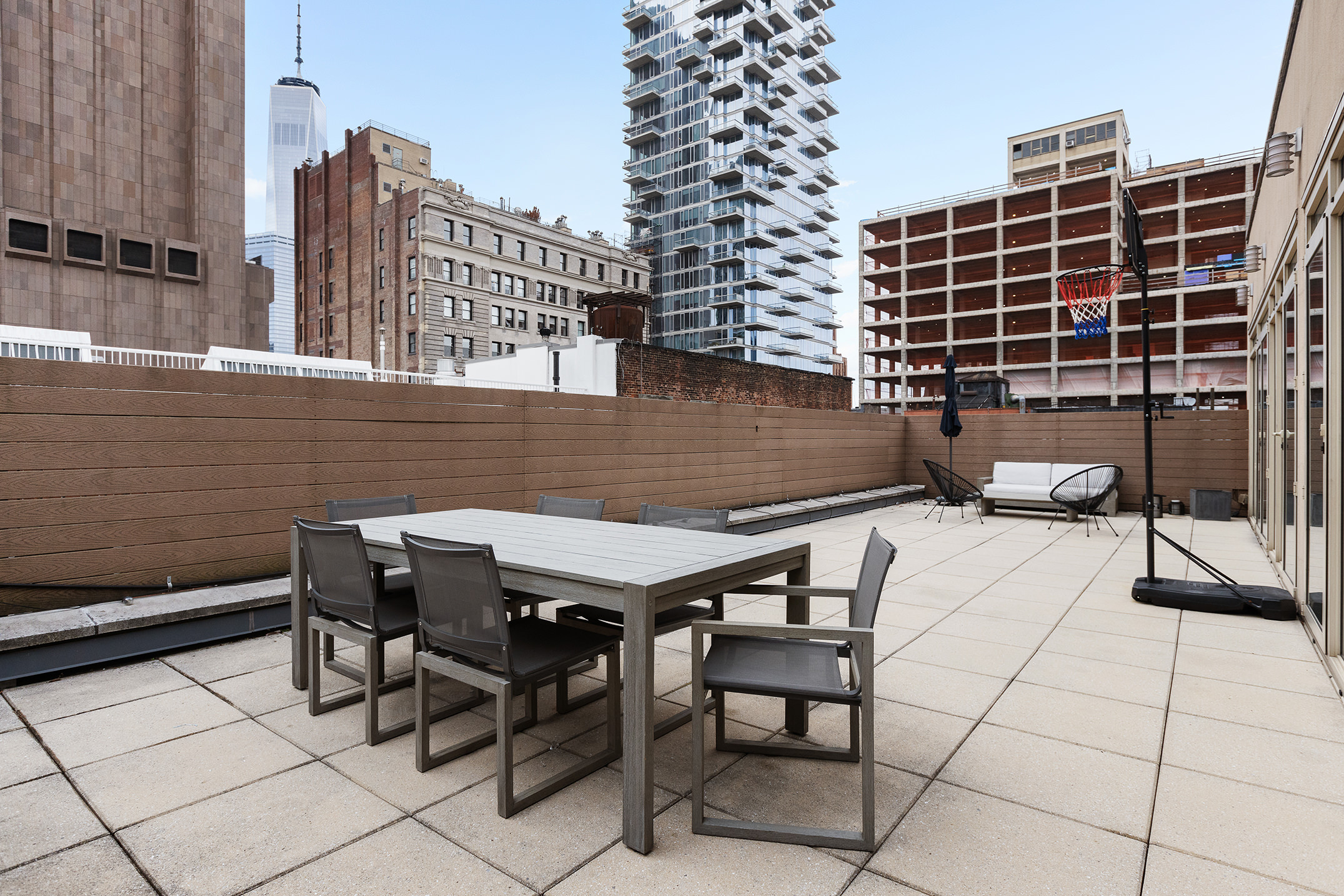 83 Franklin Street, Unit PH Manhattan, NY 10013 - Photo 6 of 13 a roof deck with table and chairs