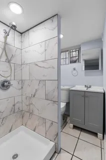 a bathroom with a tub and a sink