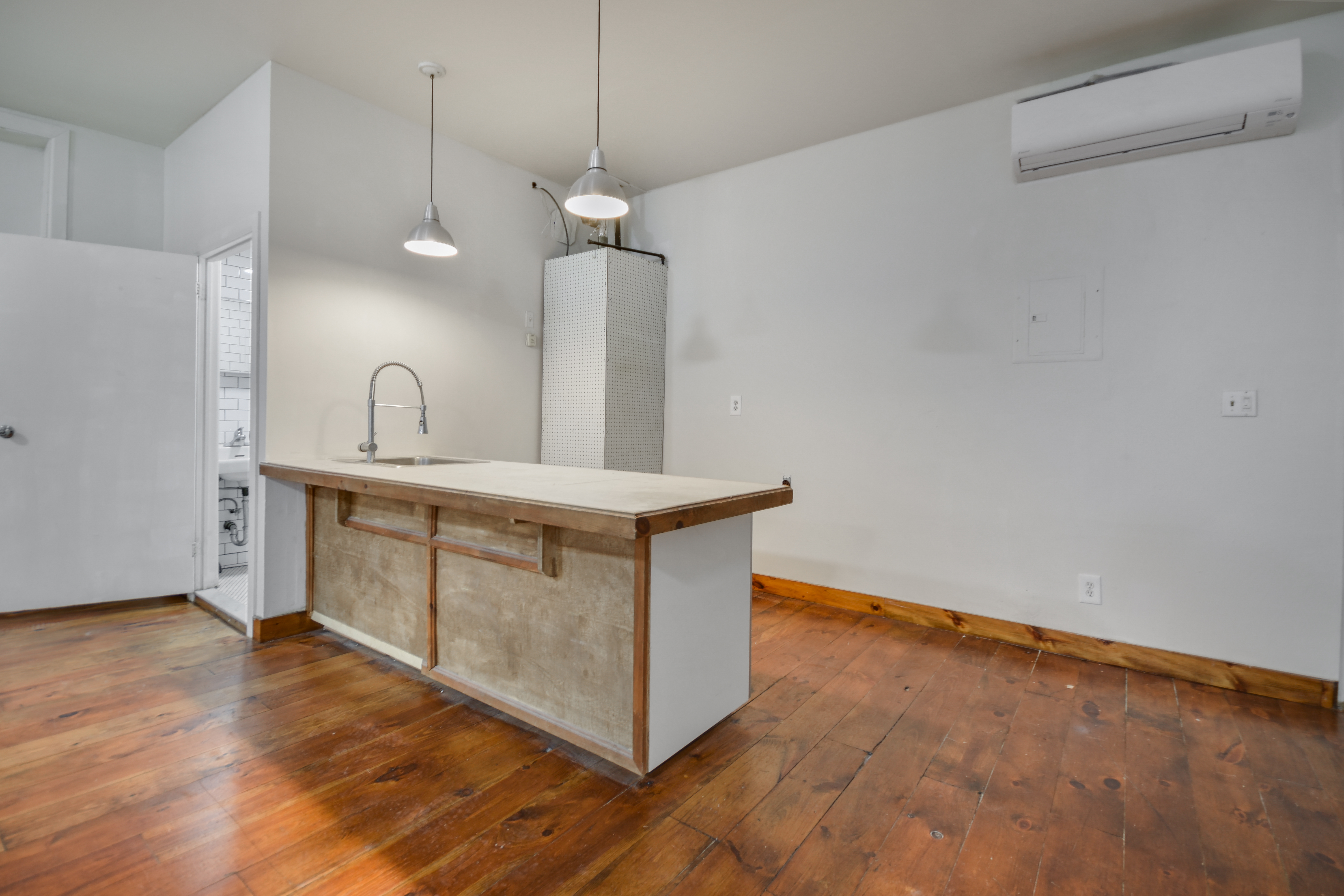 329 Broome Street, Unit 2R Manhattan, NY 10002 - Photo 3 of 6 a very nice looking room with a large window