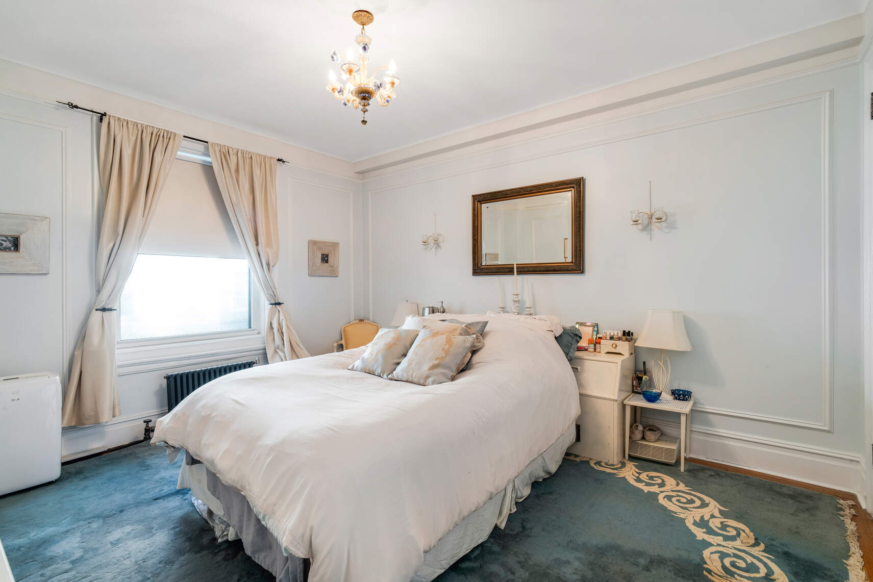 138 East 36th Street, Unit 3B Manhattan, NY 10016 - Photo 8 of 15 a bedroom with a bed and a window