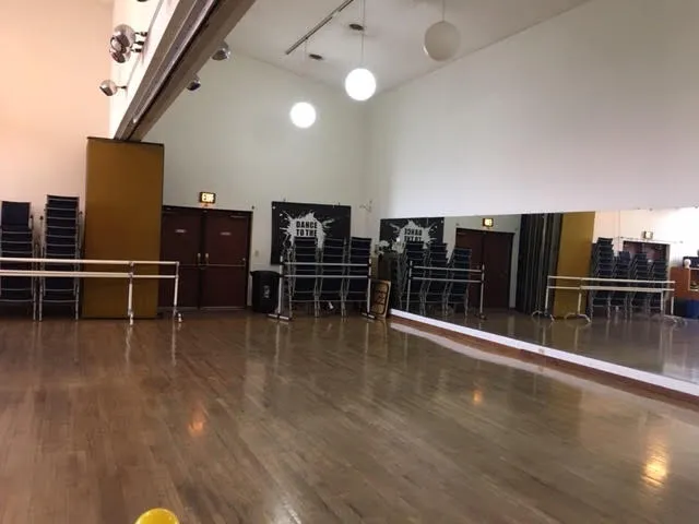 a view of a livingroom with furniture wooden floor and window