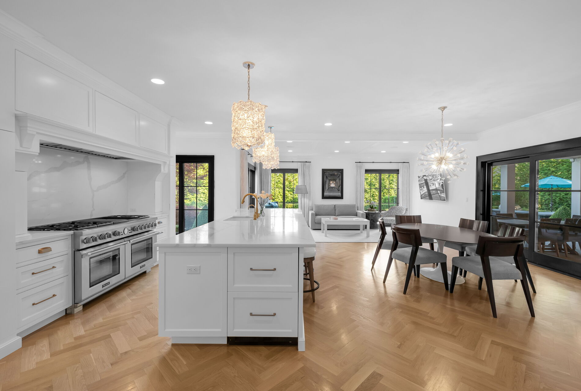 838 Seneca Road Franklin Lakes, NJ 07417 - Photo 22 of 92 a kitchen with stainless steel appliances kitchen island granite countertop a stove a sink a dining table and chairs with wooden floor