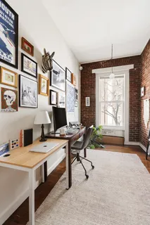 a workspace with furniture and a window