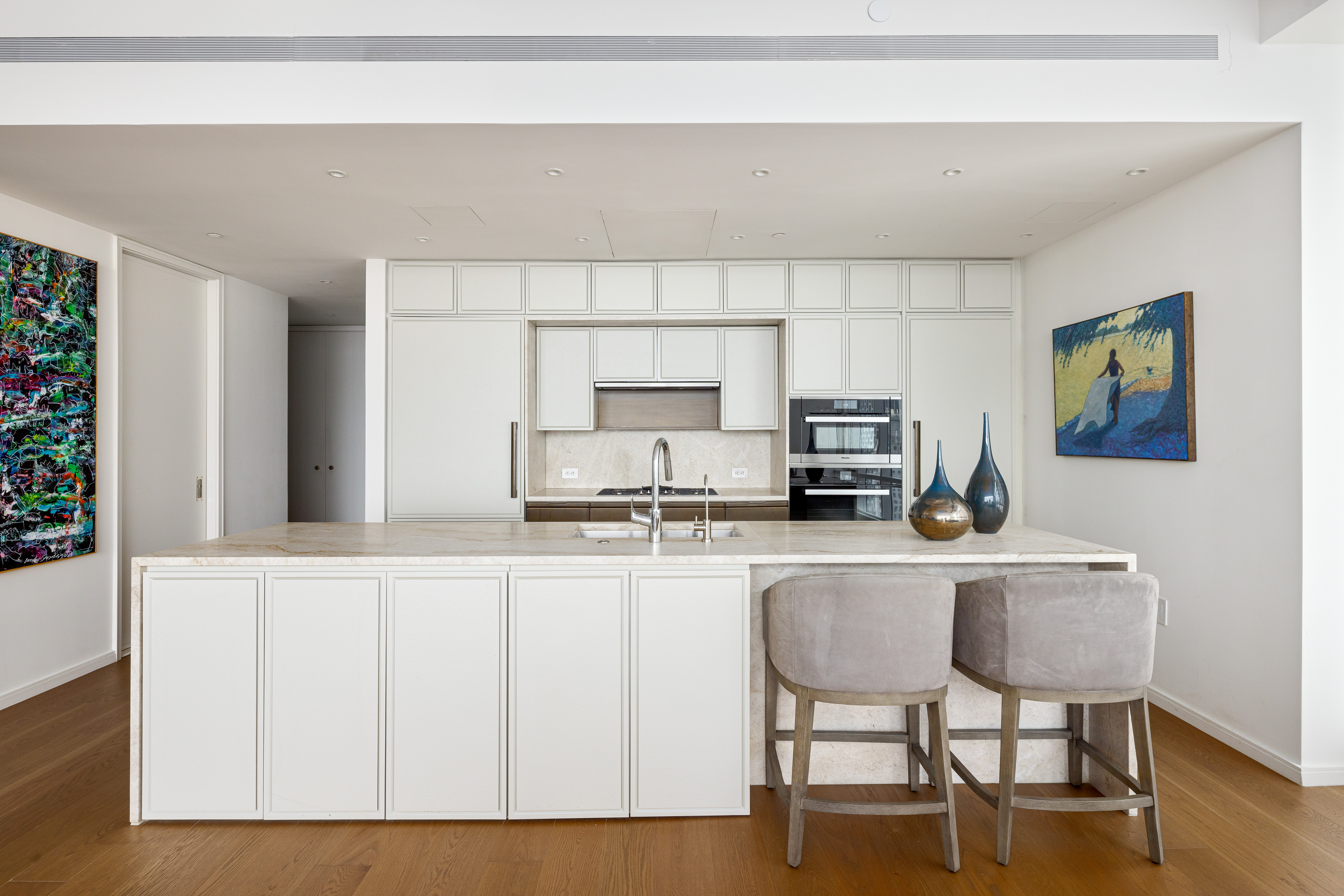 5 Beekman Street, Unit 43A Manhattan, NY 10038 - Photo 3 of 33 a kitchen with stainless steel appliances a microwave a stove and refrigerator