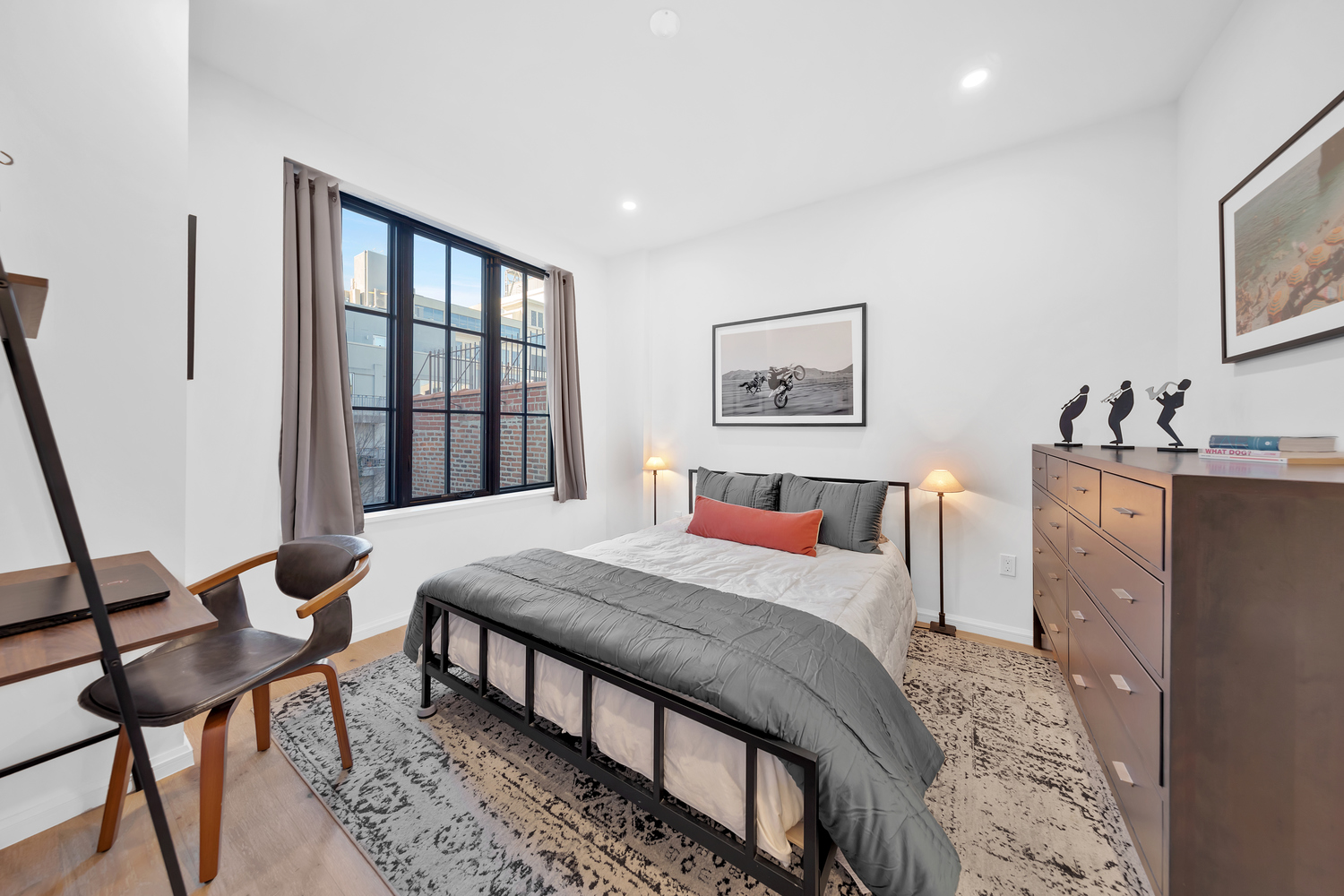 532 Clinton Avenue, Unit 5A Brooklyn, NY 11238 - Photo 7 of 11 a bedroom with a bed and a table in it