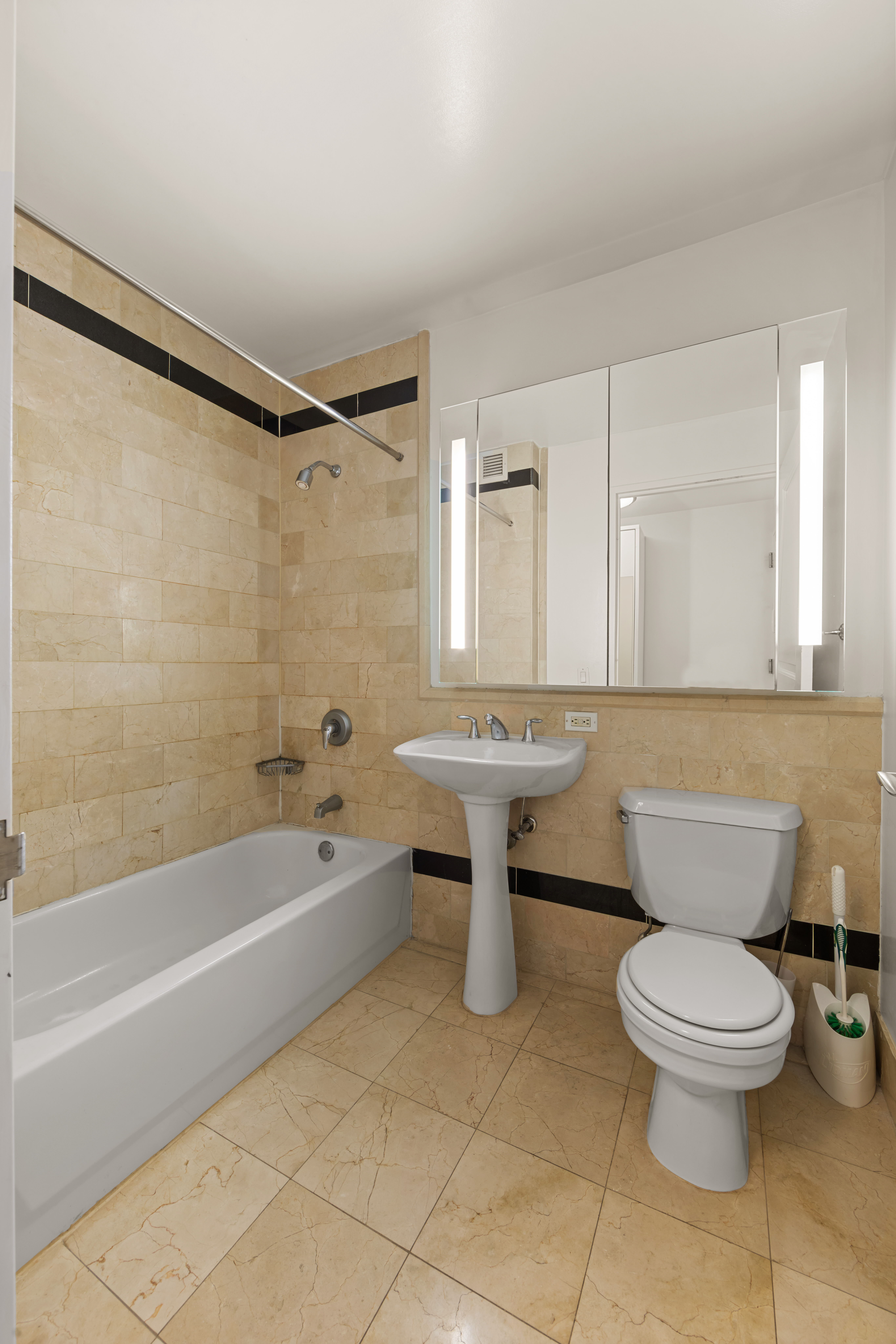 20 West Street, Unit 41D Manhattan, NY 10004 - Photo 6 of 17 a bathroom with a sink toilet and shower