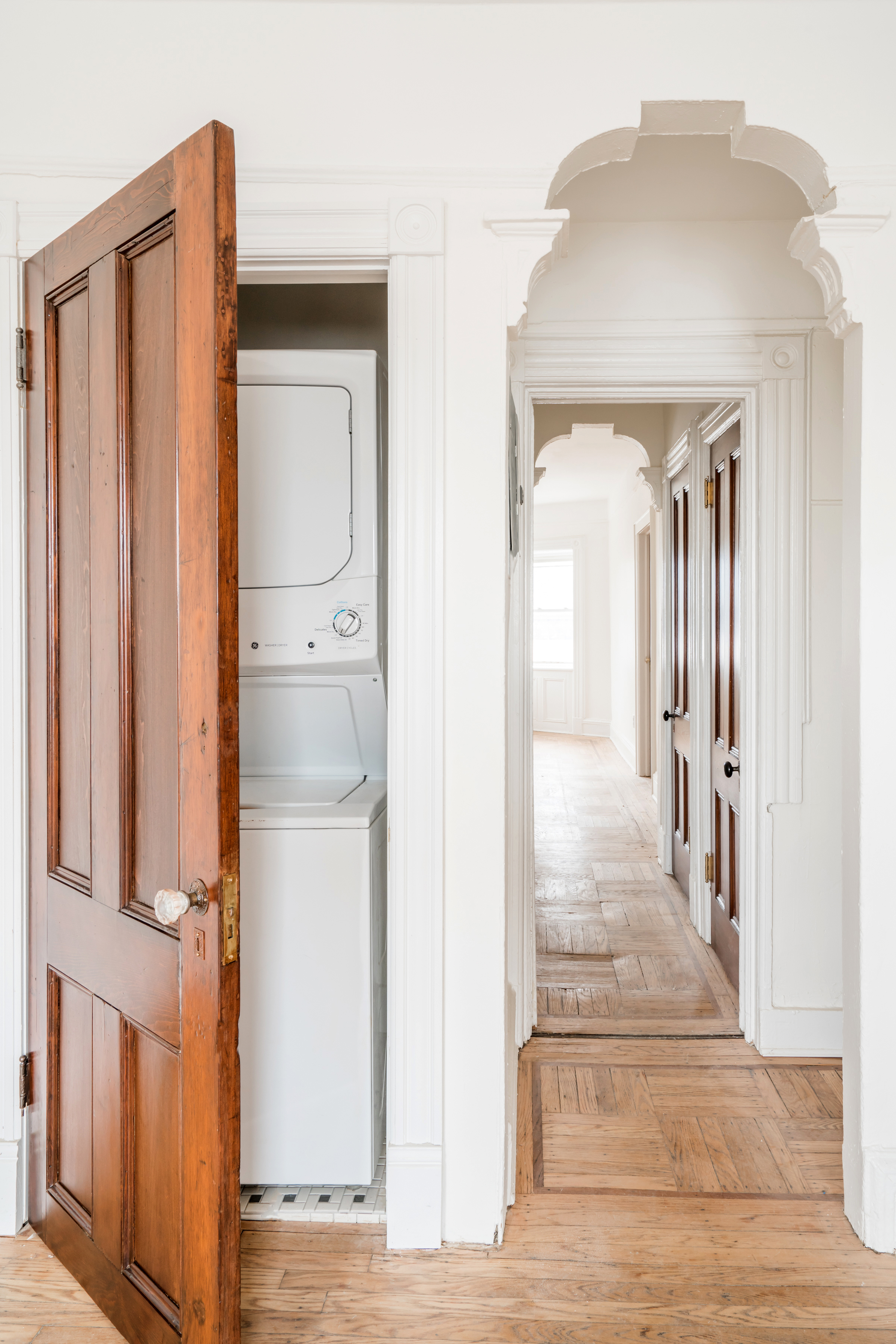 670 Macon Street, Unit 2 Brooklyn, NY 11233 - Photo 15 of 16 a view of a hallway with wooden floor and staircase