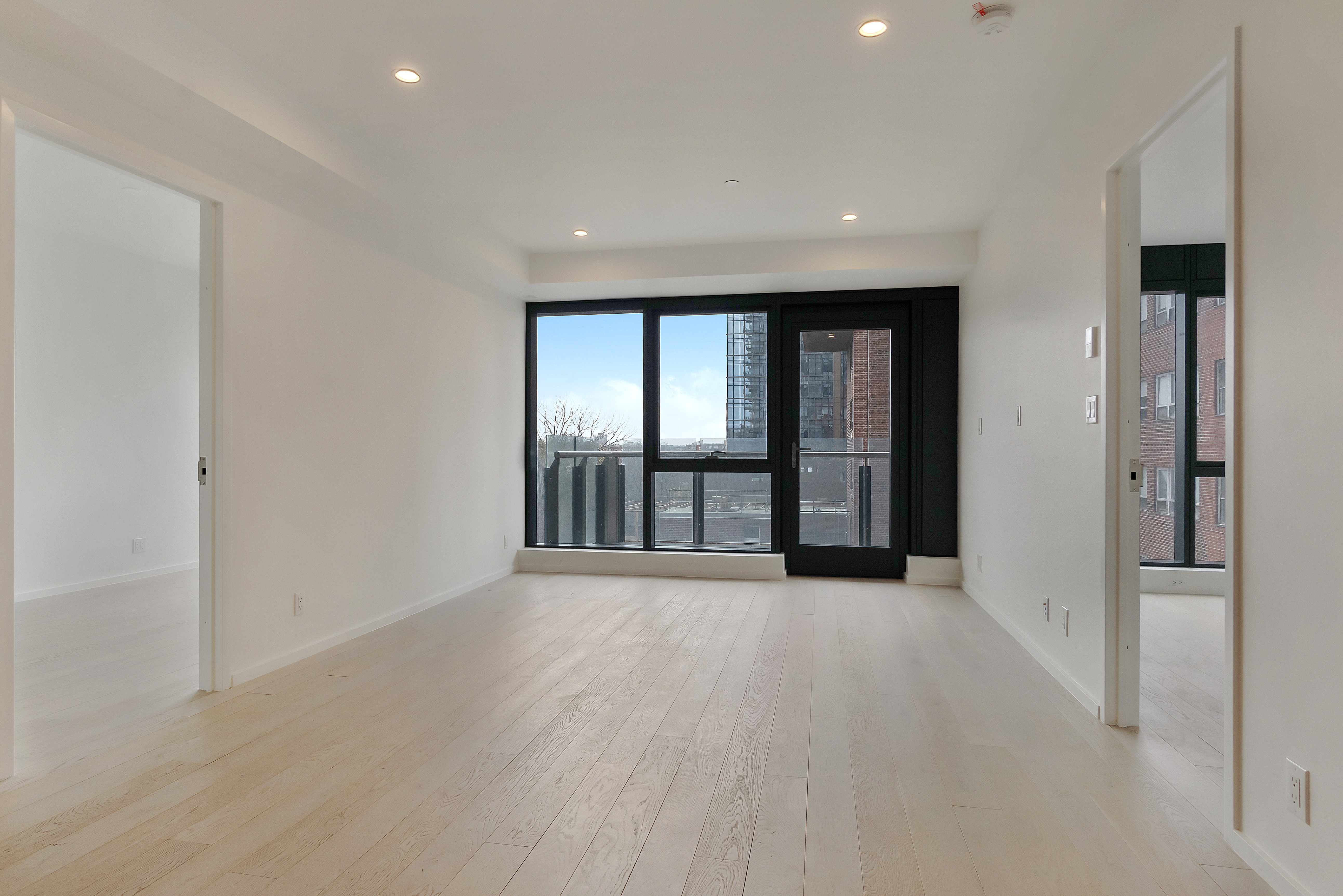 2286 Cropsey Avenue, Unit 6G Brooklyn, NY 11214 - Photo 3 of 22 wooden floor in an empty room with a window