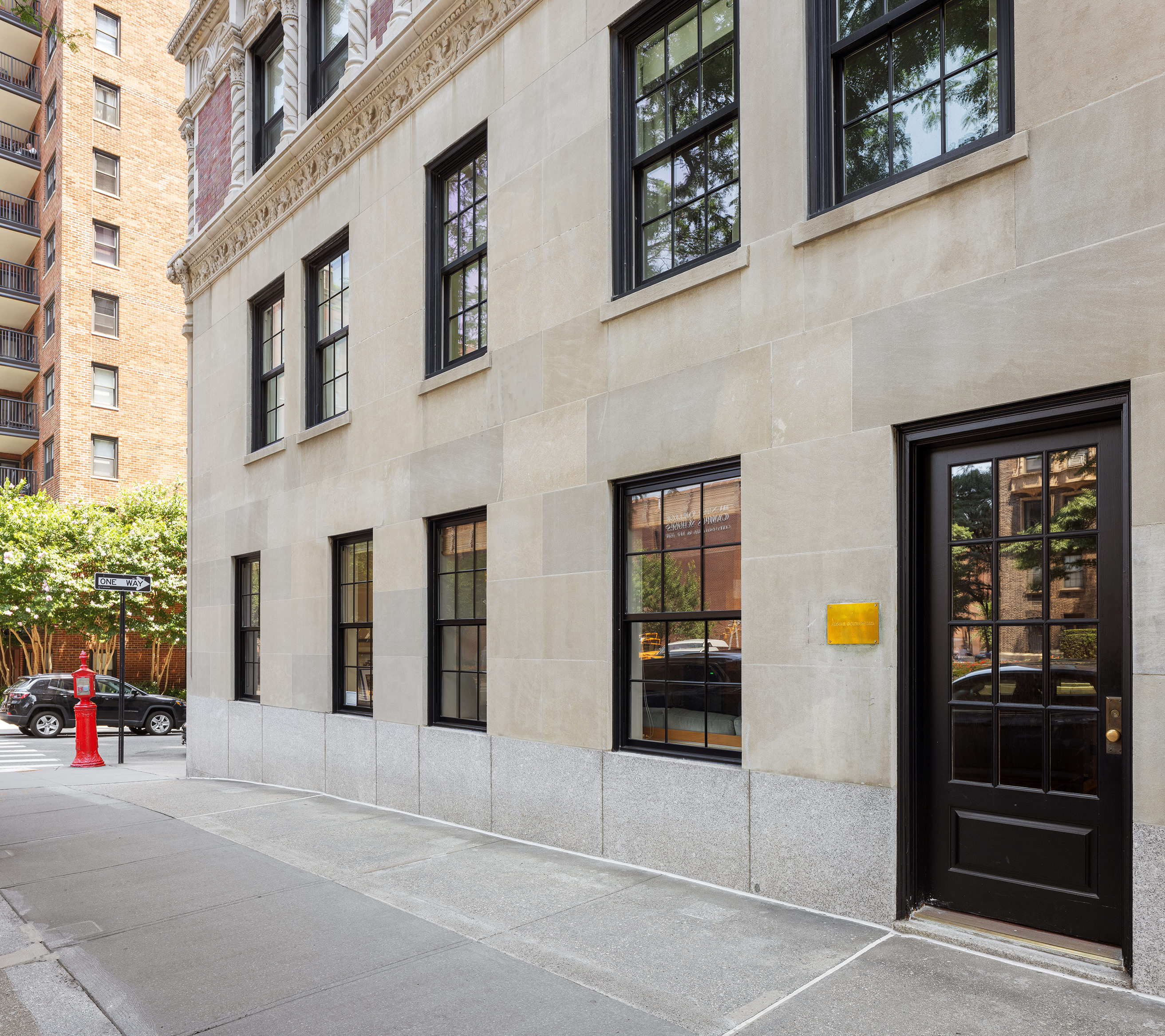 1185 Park Avenue, Unit 1A Manhattan, NY 10128 - Photo 8 of 11 a view of a building with car parked