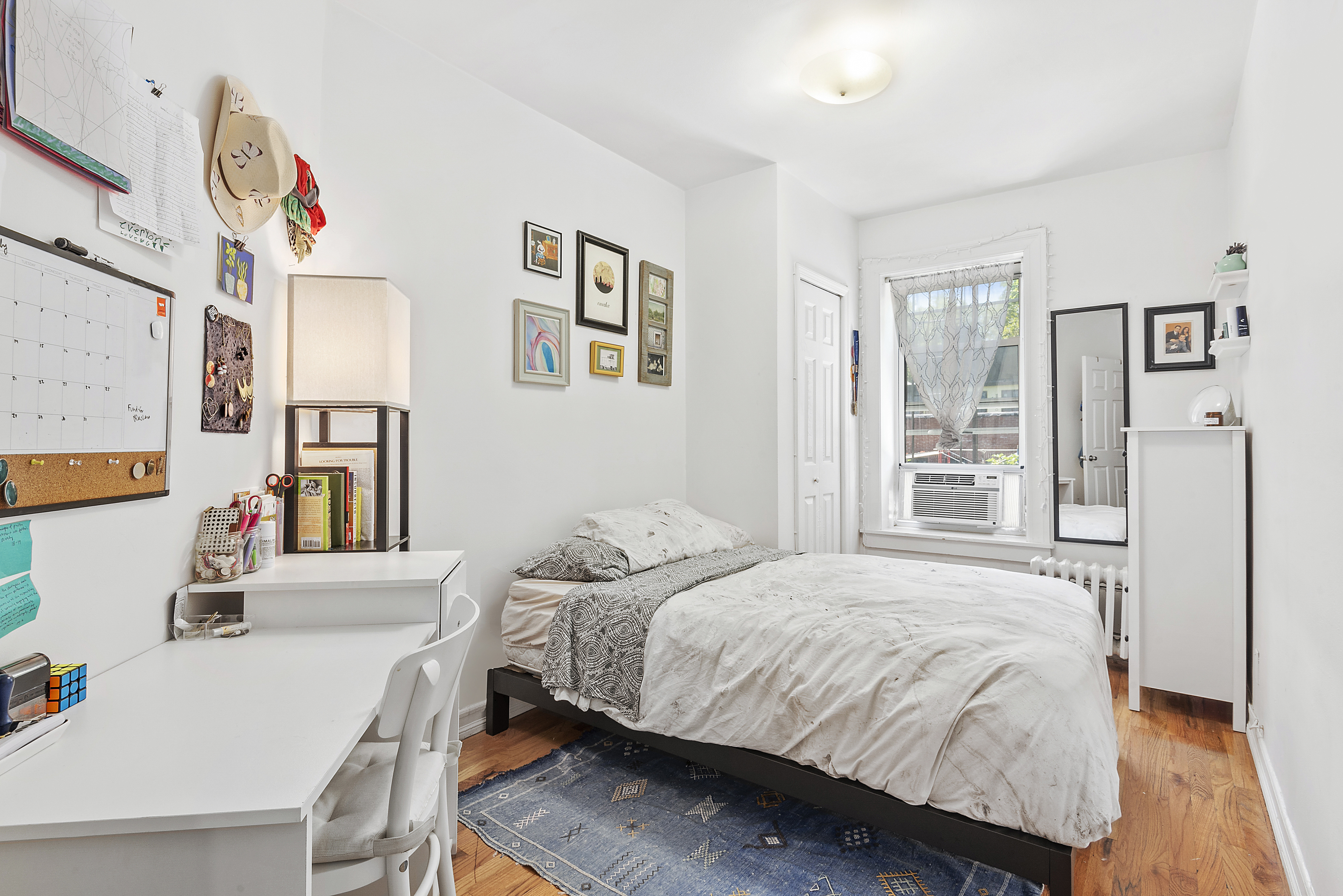 104 Dean Street, Unit 3R Brooklyn, NY 11201 - Photo 4 of 6 a bedroom with a bed and a table in it