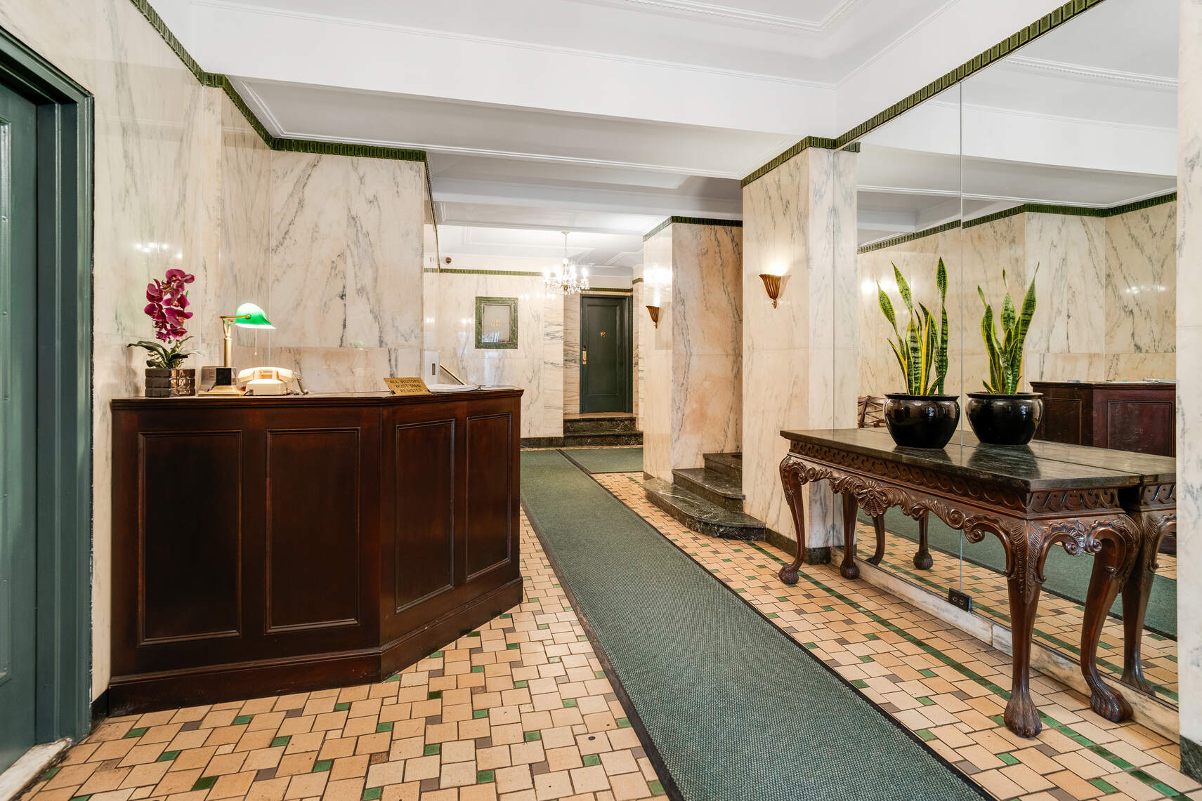 138 East 36th Street, Unit 3B Manhattan, NY 10016 - Photo 12 of 15 a room with a table chairs and wooden floor