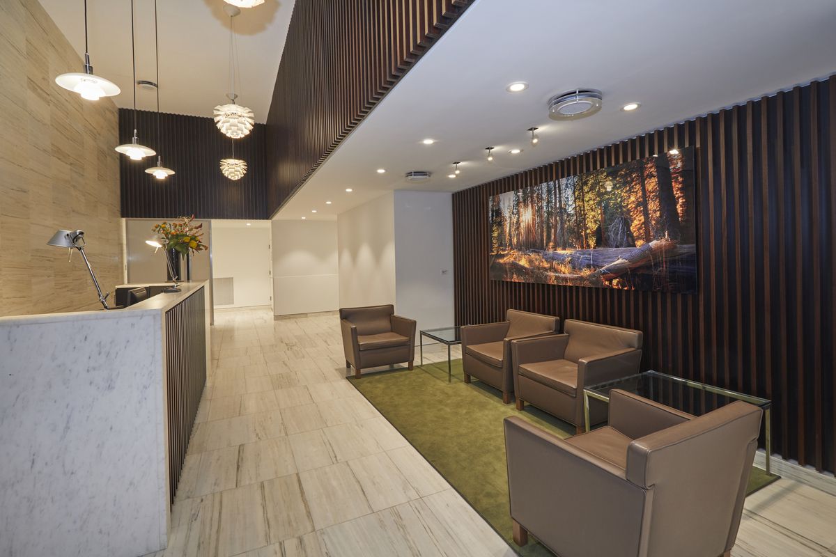 222 West 14th Street, Unit 5D Manhattan, NY 10011 - Photo 7 of 9 a lobby with furniture and a potted plant