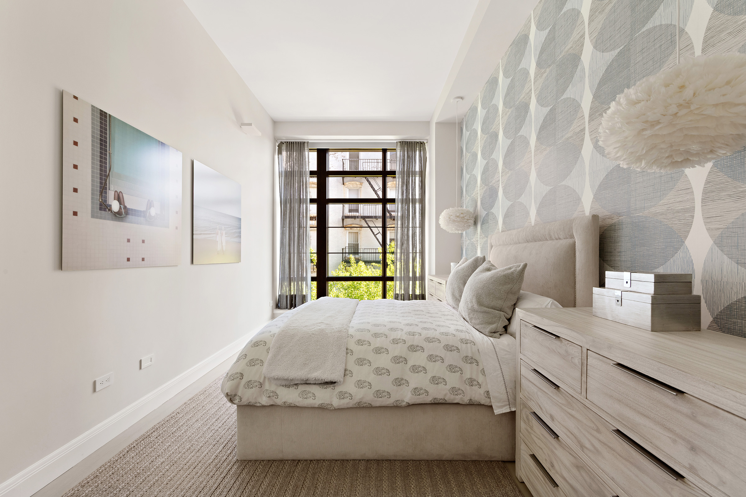 150 Charles Street, Unit M10 Manhattan, NY 10014 - Photo 15 of 34 a bedroom with a bed and window