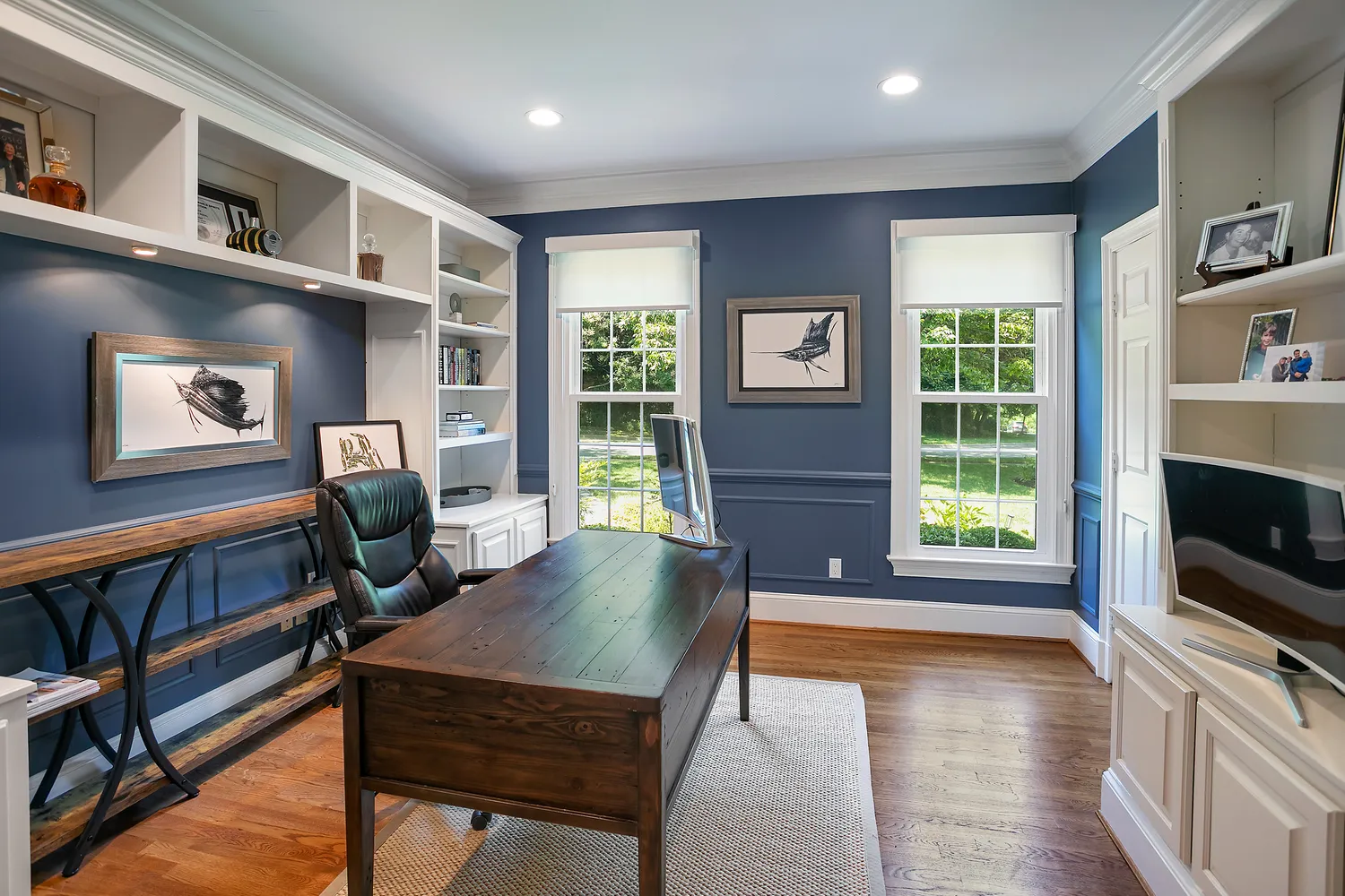 a living room with fireplace furniture and a flat screen tv