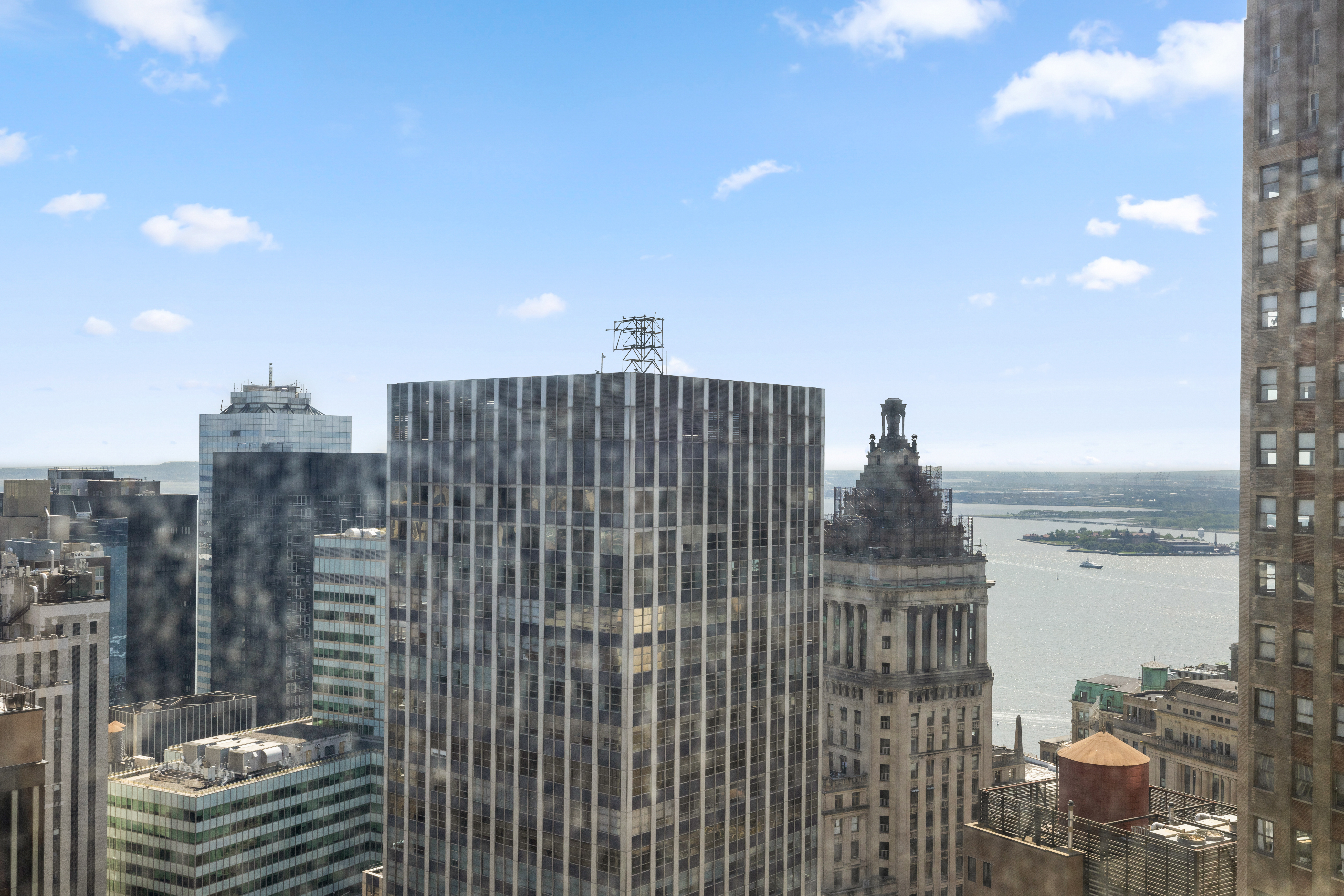 15 Broad Street, Unit 3930 Manhattan, NY 10005 - Photo 13 of 21 a view of a city with tall buildings