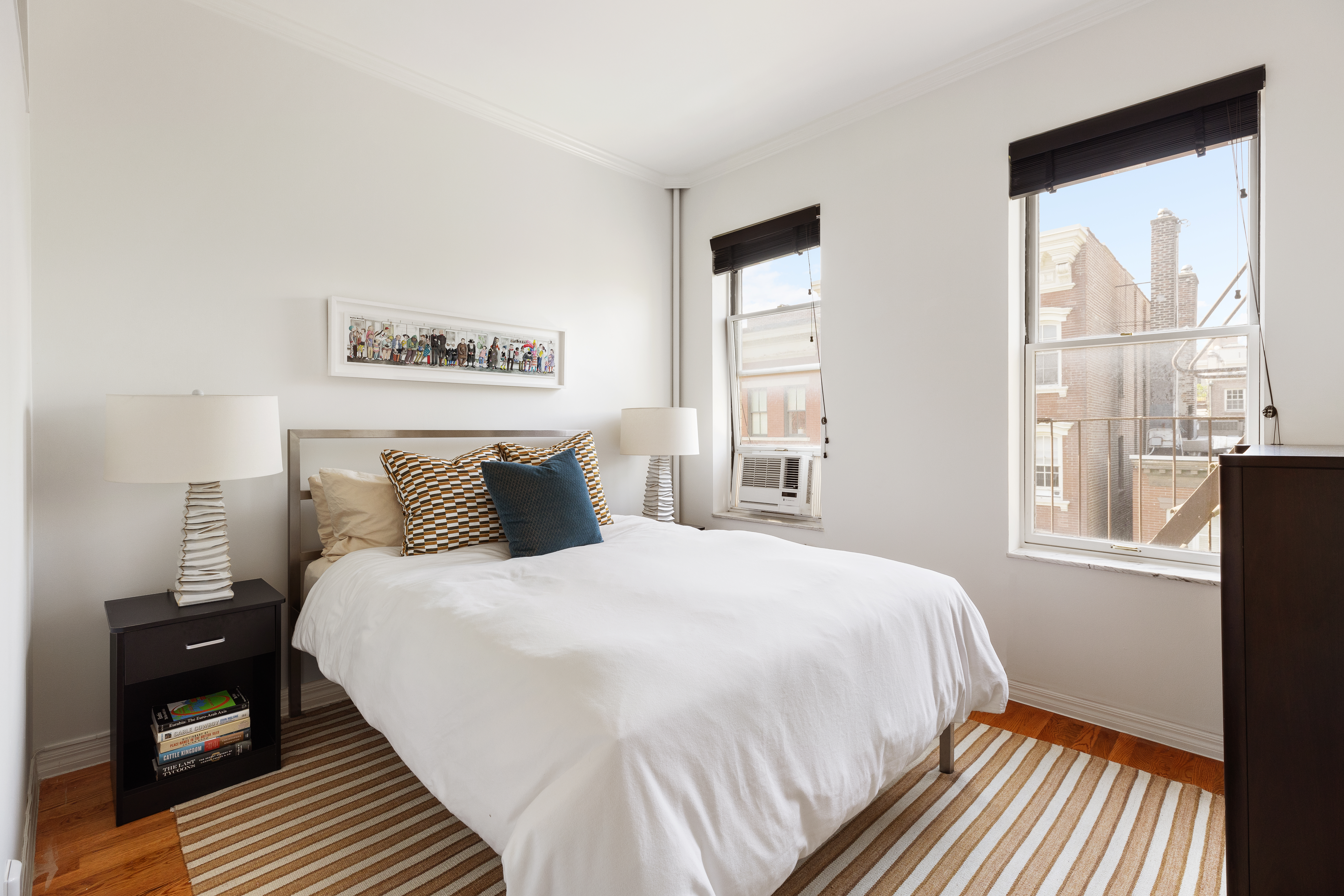 28 Perry Street, Unit 4W Manhattan, NY 10014 - Photo 5 of 7 a bedroom with a bed and a window