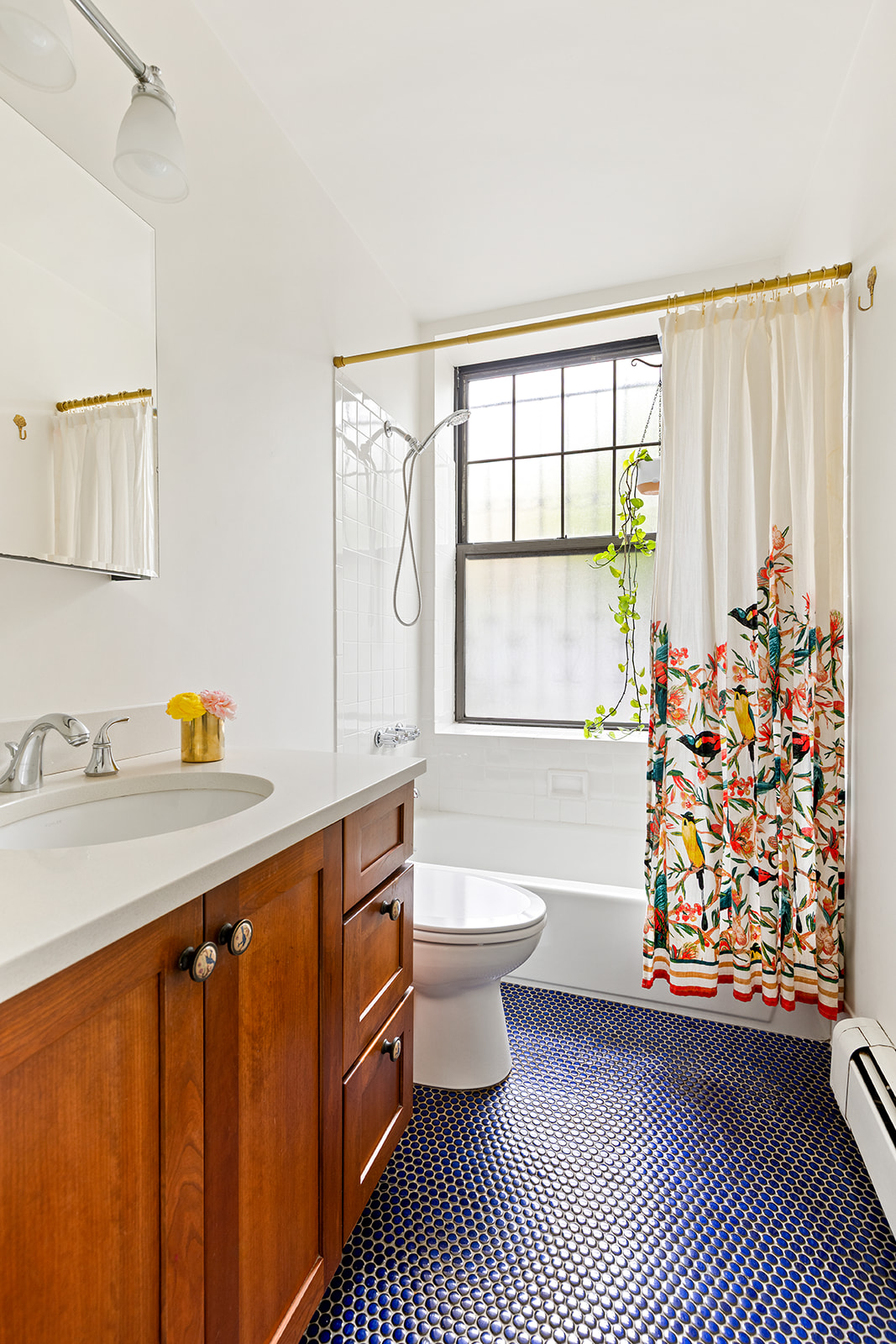 295 St Johns Place, Unit 1A Brooklyn, NY 11238 - Photo 7 of 13 a bathroom with a sink a toilet and shower curtain