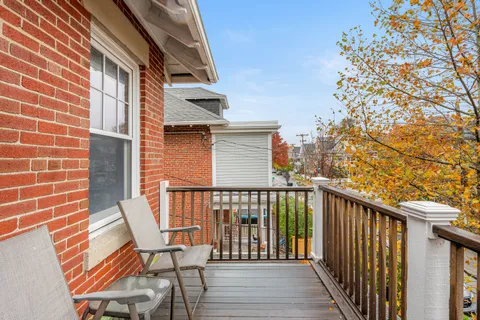 a view of a chairs on the roof deck