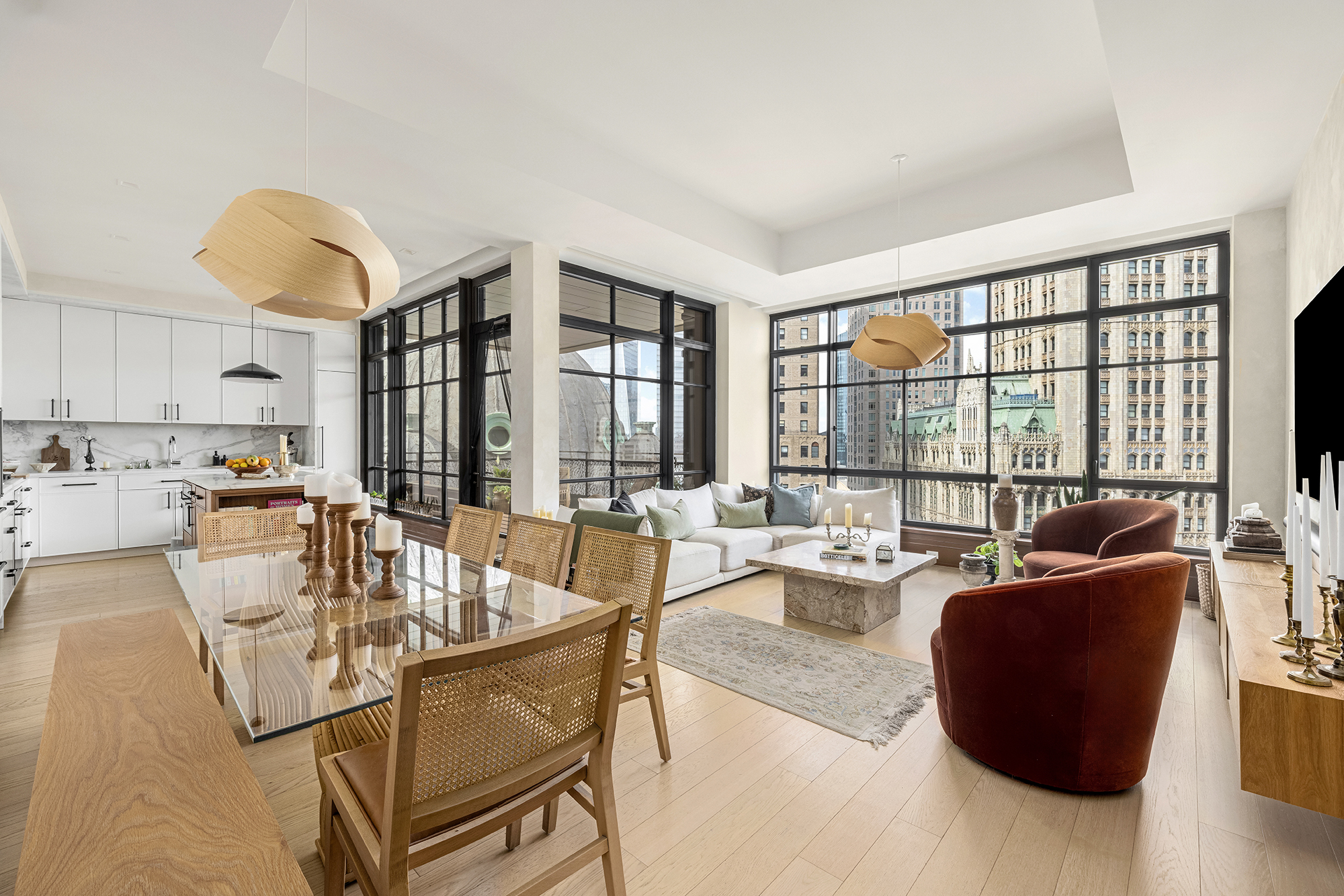25 Park Row, Unit 29A Manhattan, NY 10038 - Photo 3 of 23 a living room with fireplace furniture and a large window