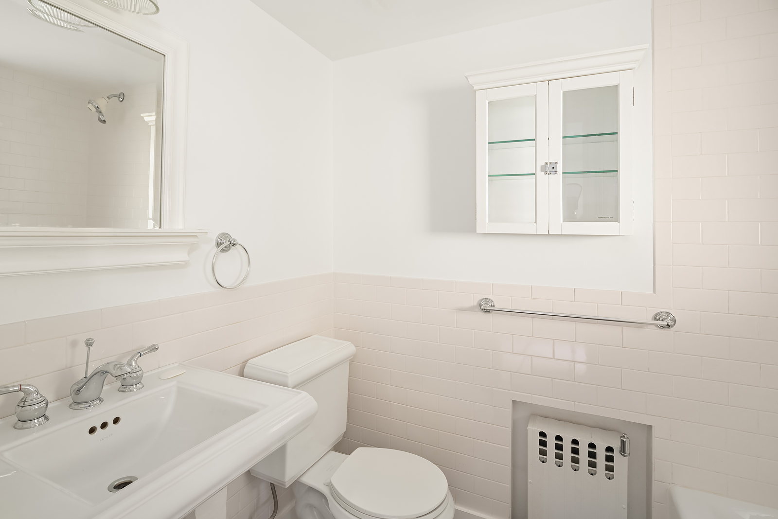 204 Warren Street Brooklyn, NY 11201 - Photo 25 of 29 a bathroom with a sink a toilet and a mirror