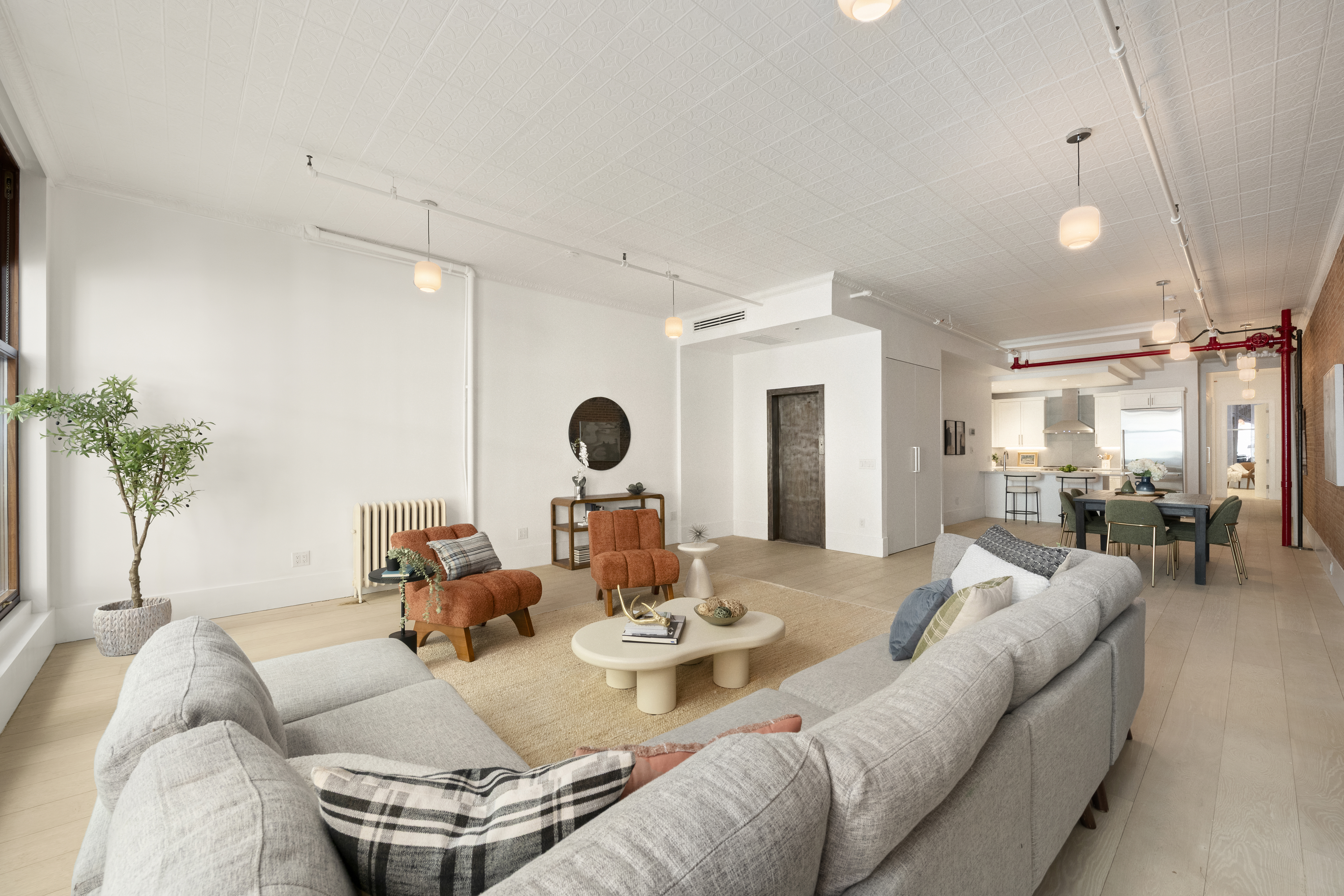 48 West 22nd Street, Unit 2 Manhattan, NY 10010 - Photo 2 of 8 a living room with furniture and a large window