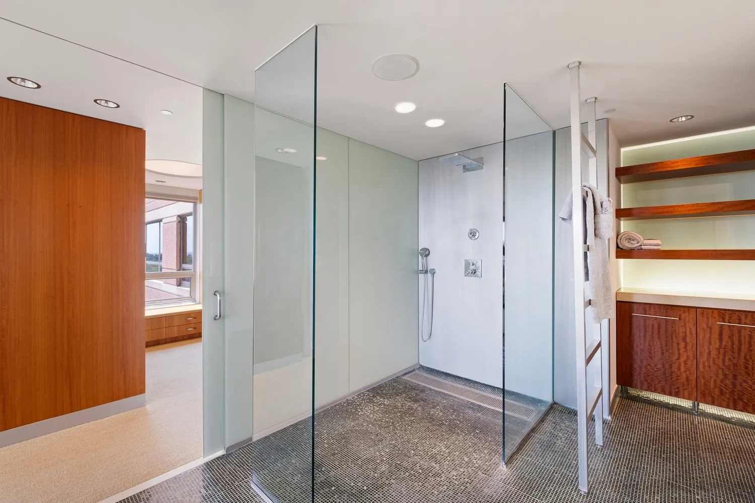 a lobby with furniture and chandelier