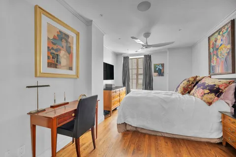 a bedroom with a bed and a table