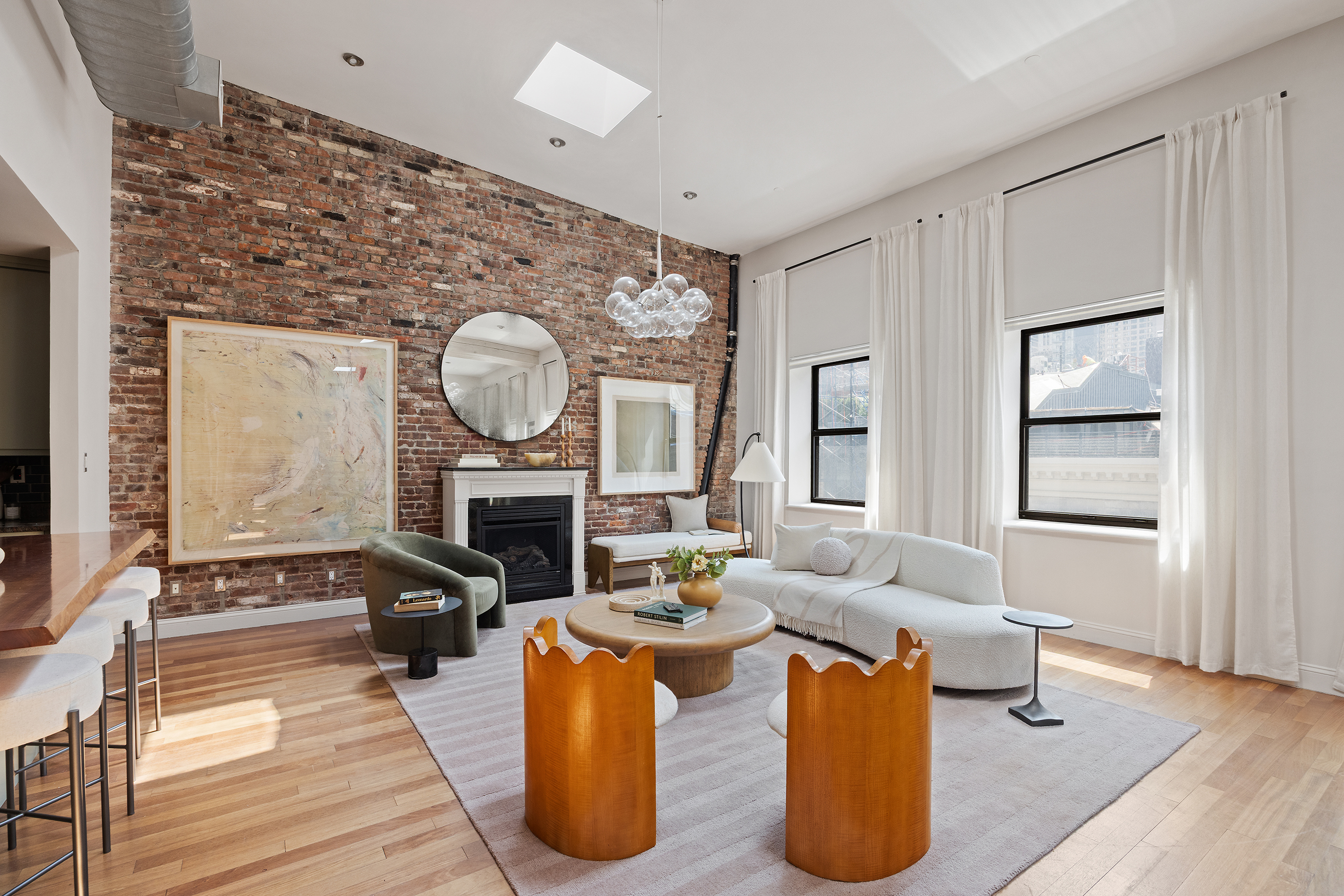 100 Reade Street, Unit 6CD Manhattan, NY 10013 - Photo 5 of 26 a living room with furniture a fireplace and a potted plant