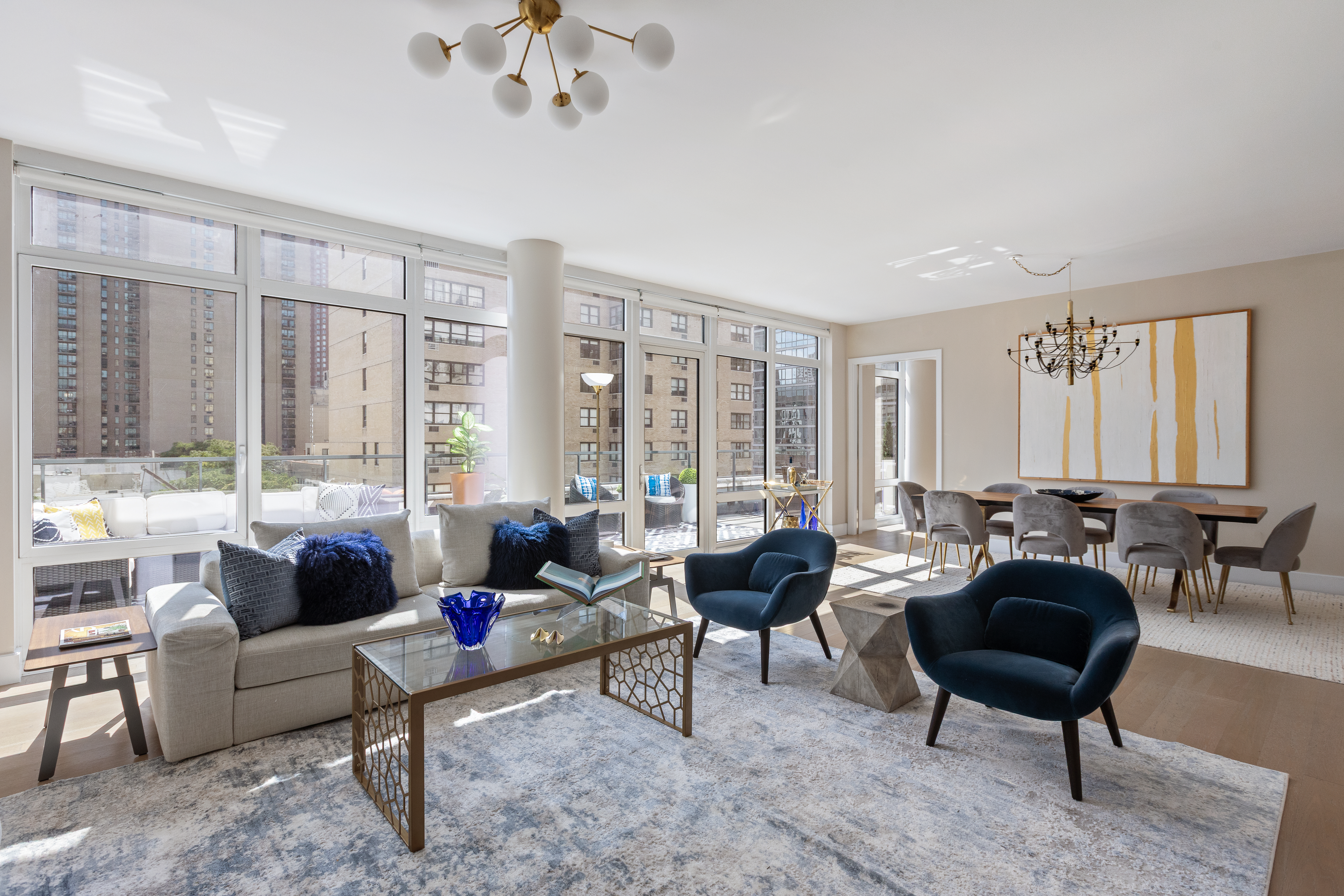 1355 1st Avenue, Unit 8 Manhattan, NY 10021 - Photo 2 of 25 a living room with furniture and a large window